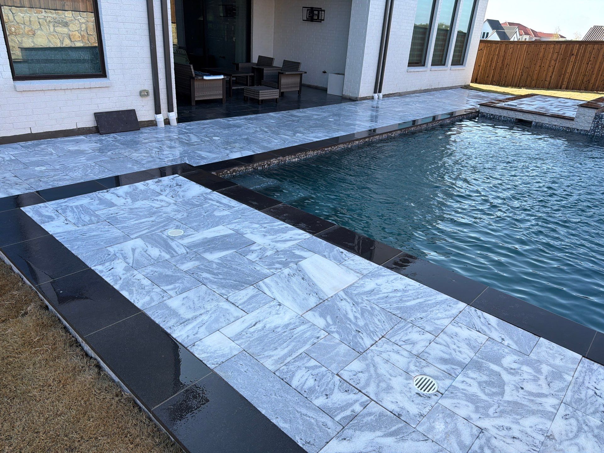 Modern Geometric Pool with Raised Spa and Marble Deck by Pinnacle Pools and Spas - DFW