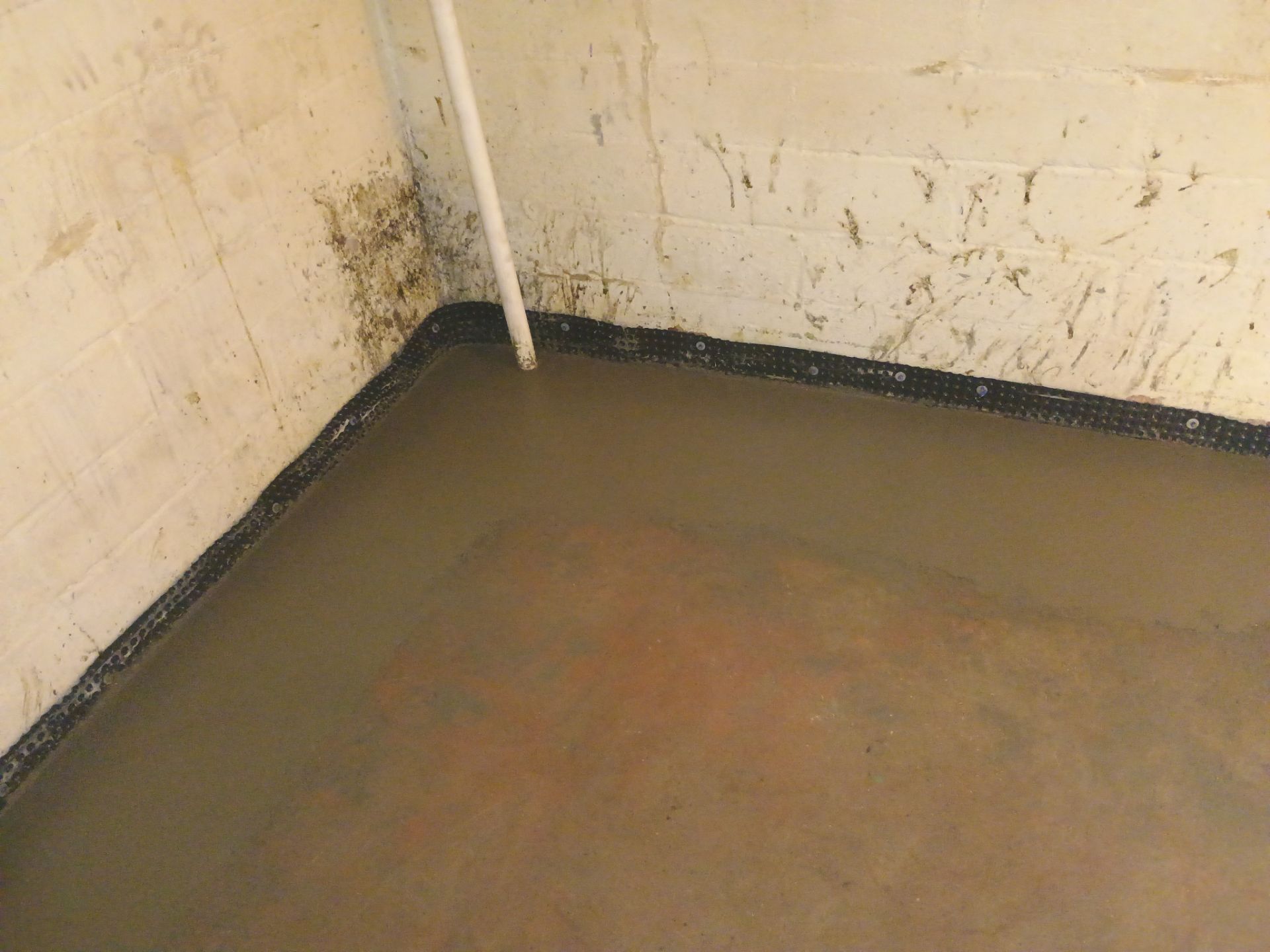 Interior Drain Tile & Sump Pump System in North Minneapolis by Waterproofing Northeast