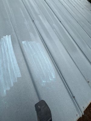 Close up of metal roof panel with chalk markings