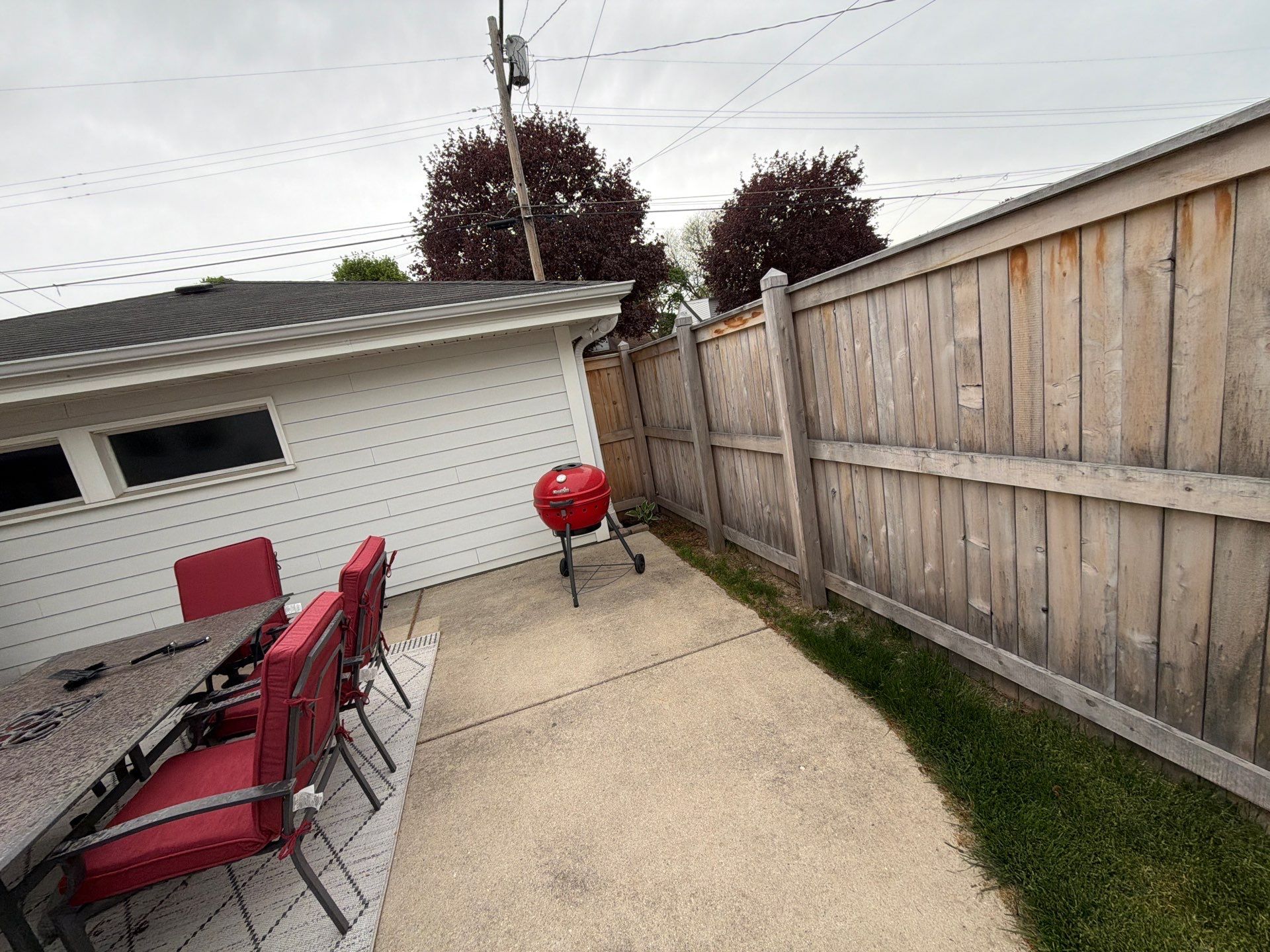 Milwaukee Wood Privacy Fence Installation and Concrete Patio Upgrade by OCS Contracting Services
