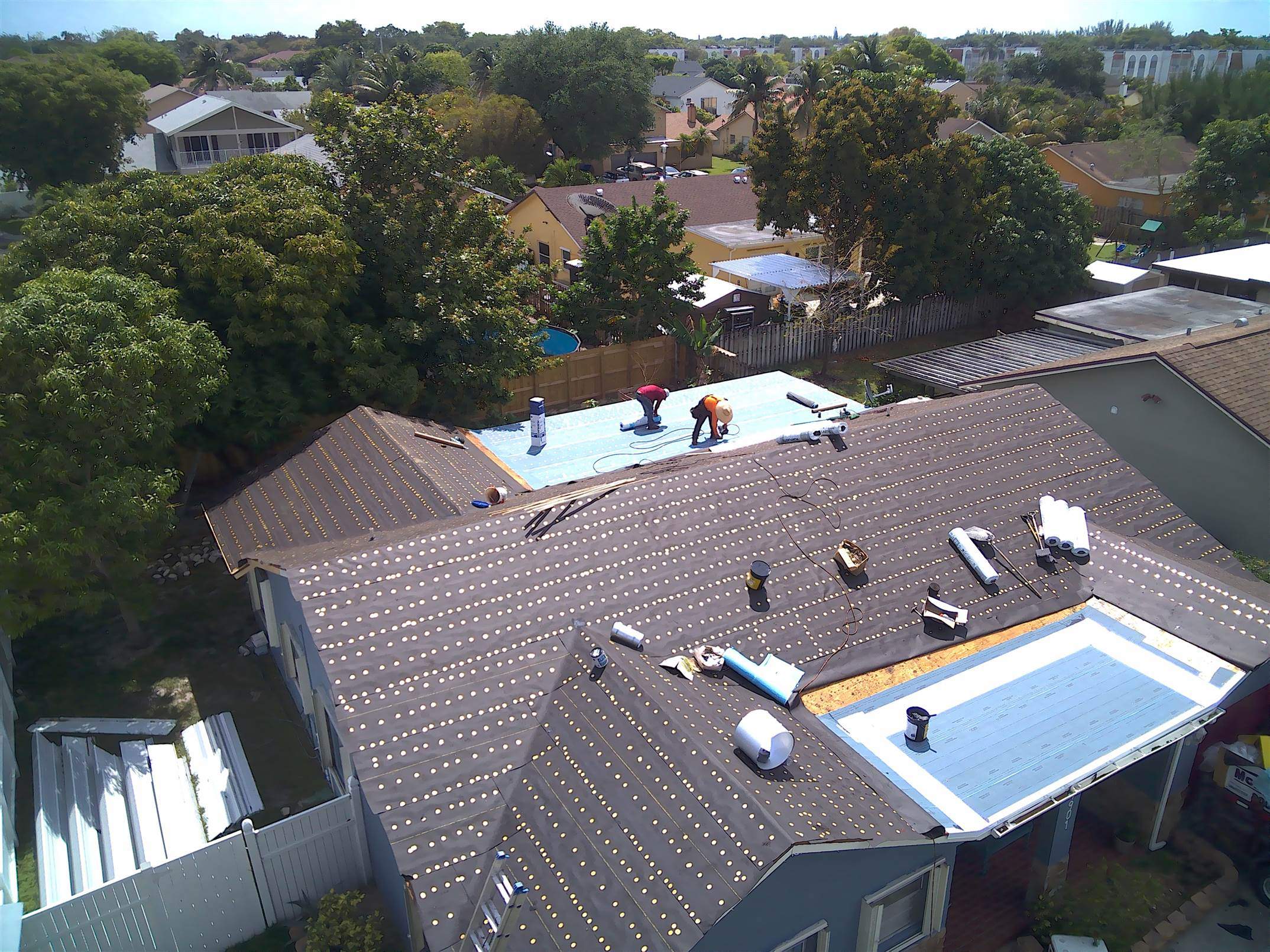 Standing Seam Metal & Flat Re-Roof using 1.5" Nail Strip 24ga Solar White Kynar Coated Standing Seam Metal Panels by Morton Roofing, Inc.