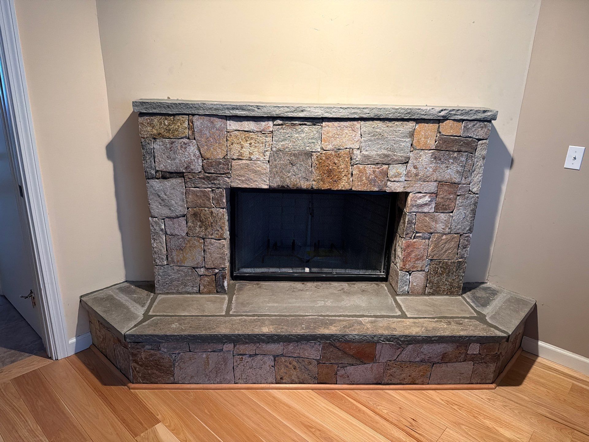 Wood Fireplace w/ Reused Stone by Neighborhood Chimney Services 