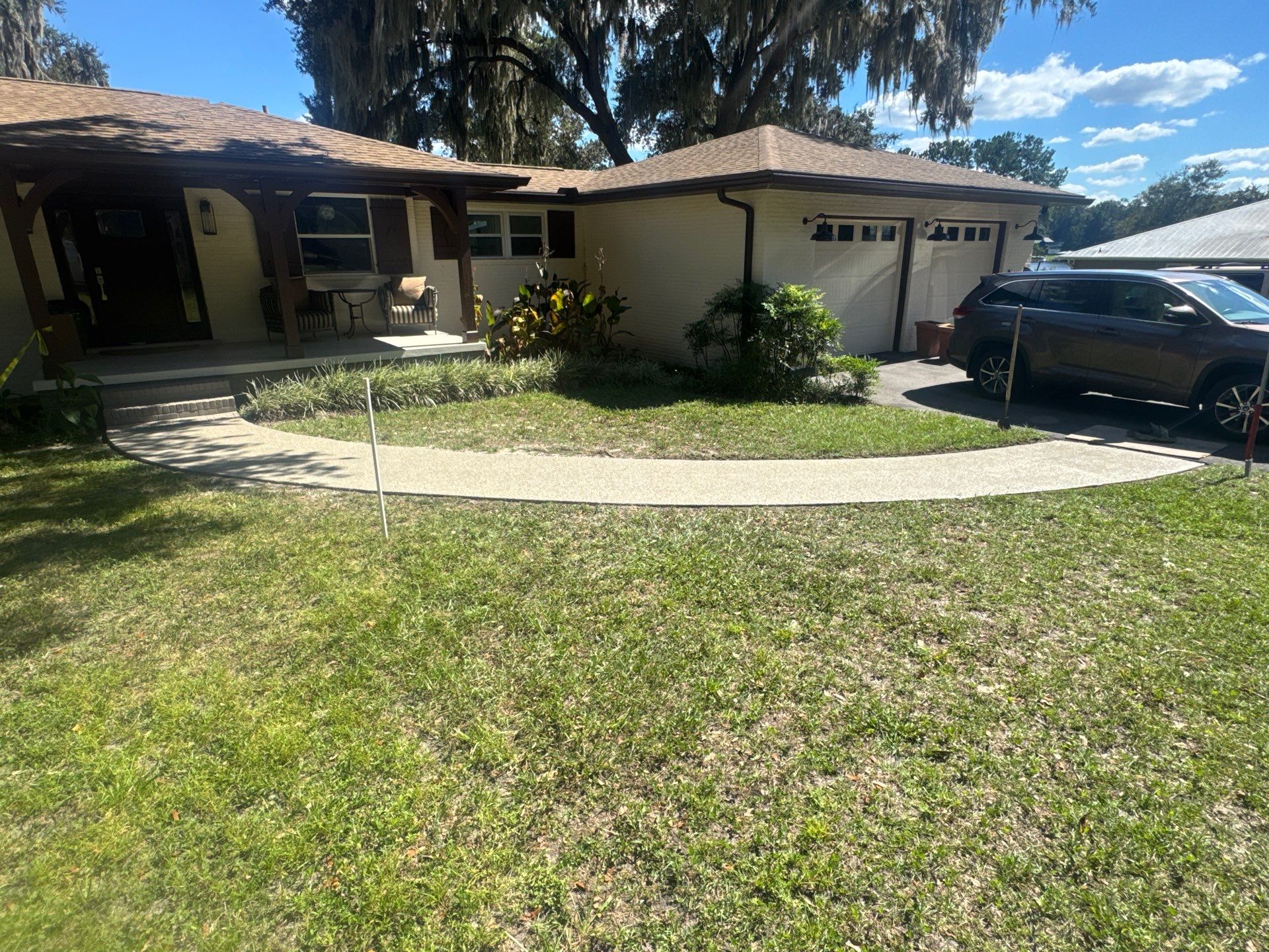Garage and Sidewalk Project in Keystone Heights, FL in Pebble Beach by Cross Creek Concrete Coatings