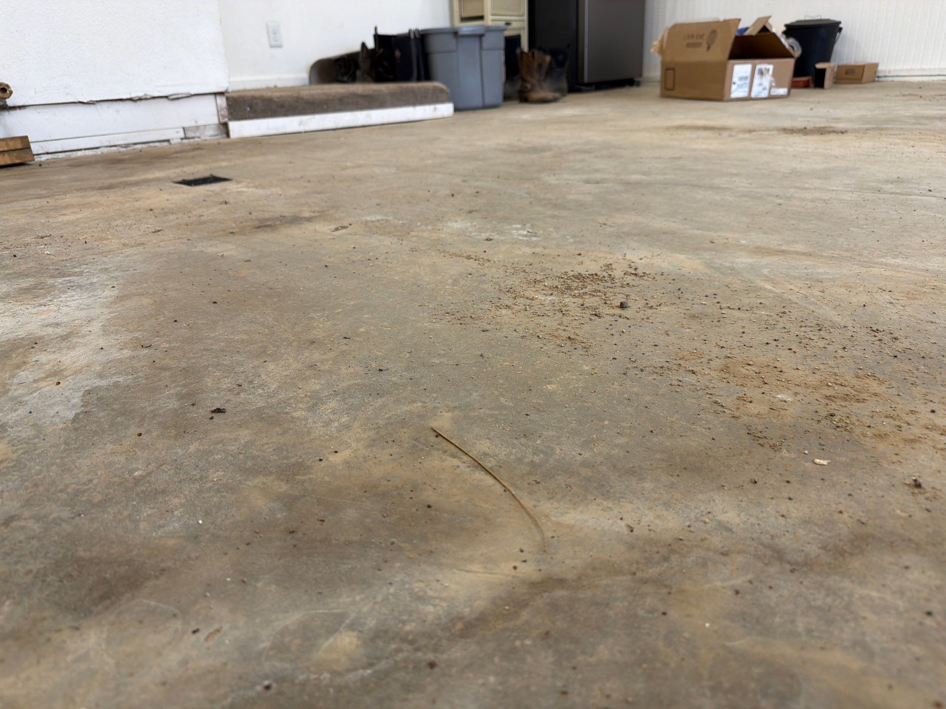 Feather Grey Garage Floor Coating and Crack Repair in Beresford by Select Painting, Coatings & Garage Cabinets