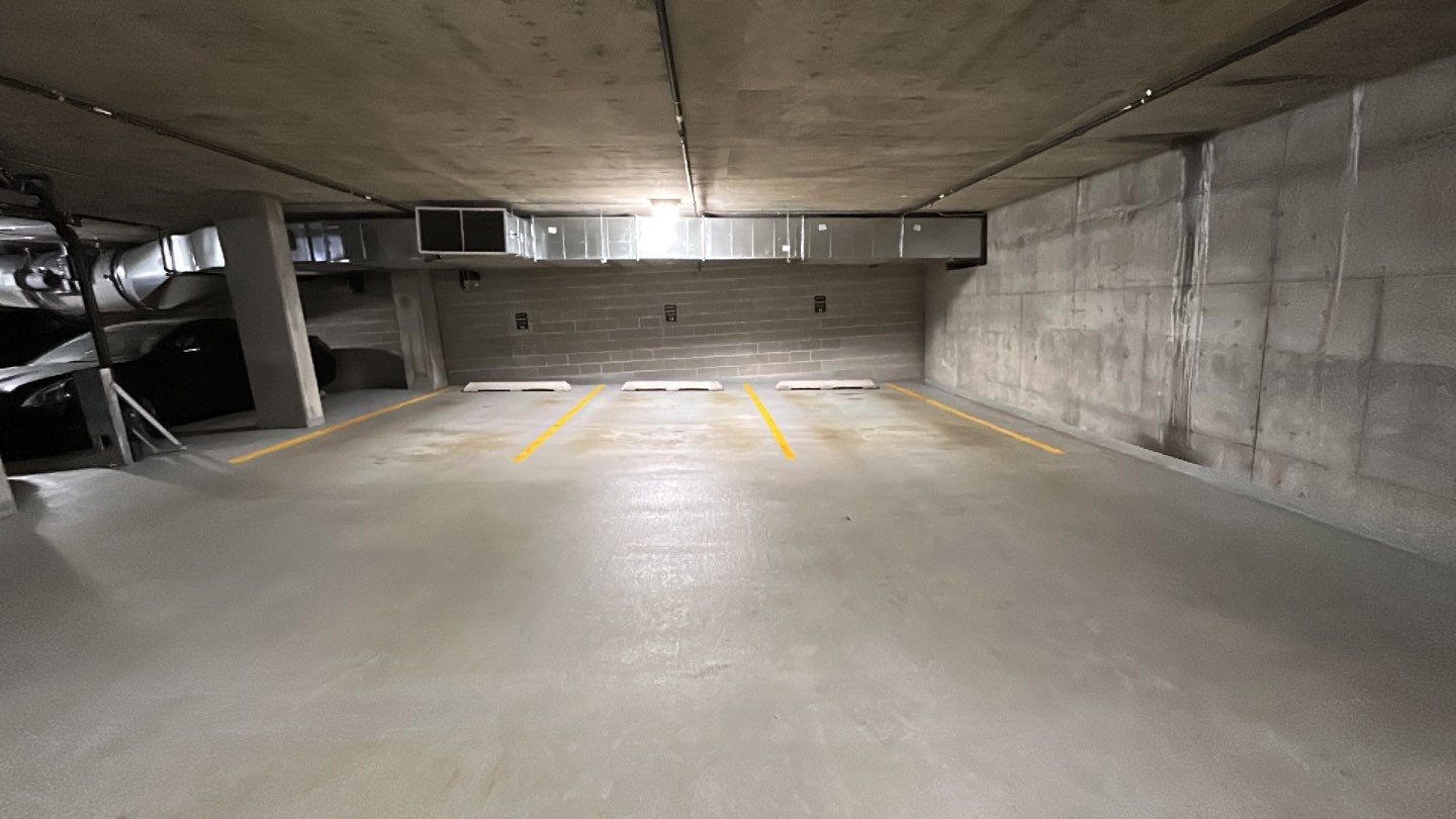 Parking garage using Hot water by Northern Power Washing LLC.