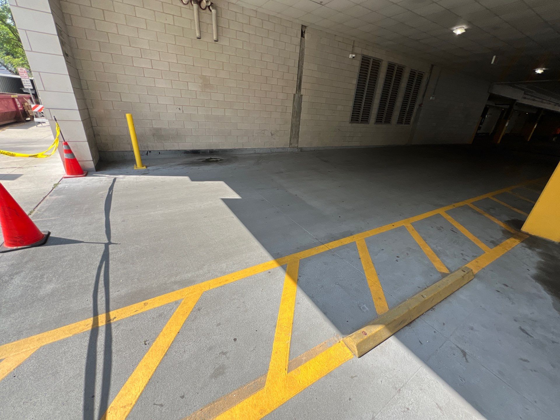 Parking garage using Hot water by Northern Power Washing LLC.
