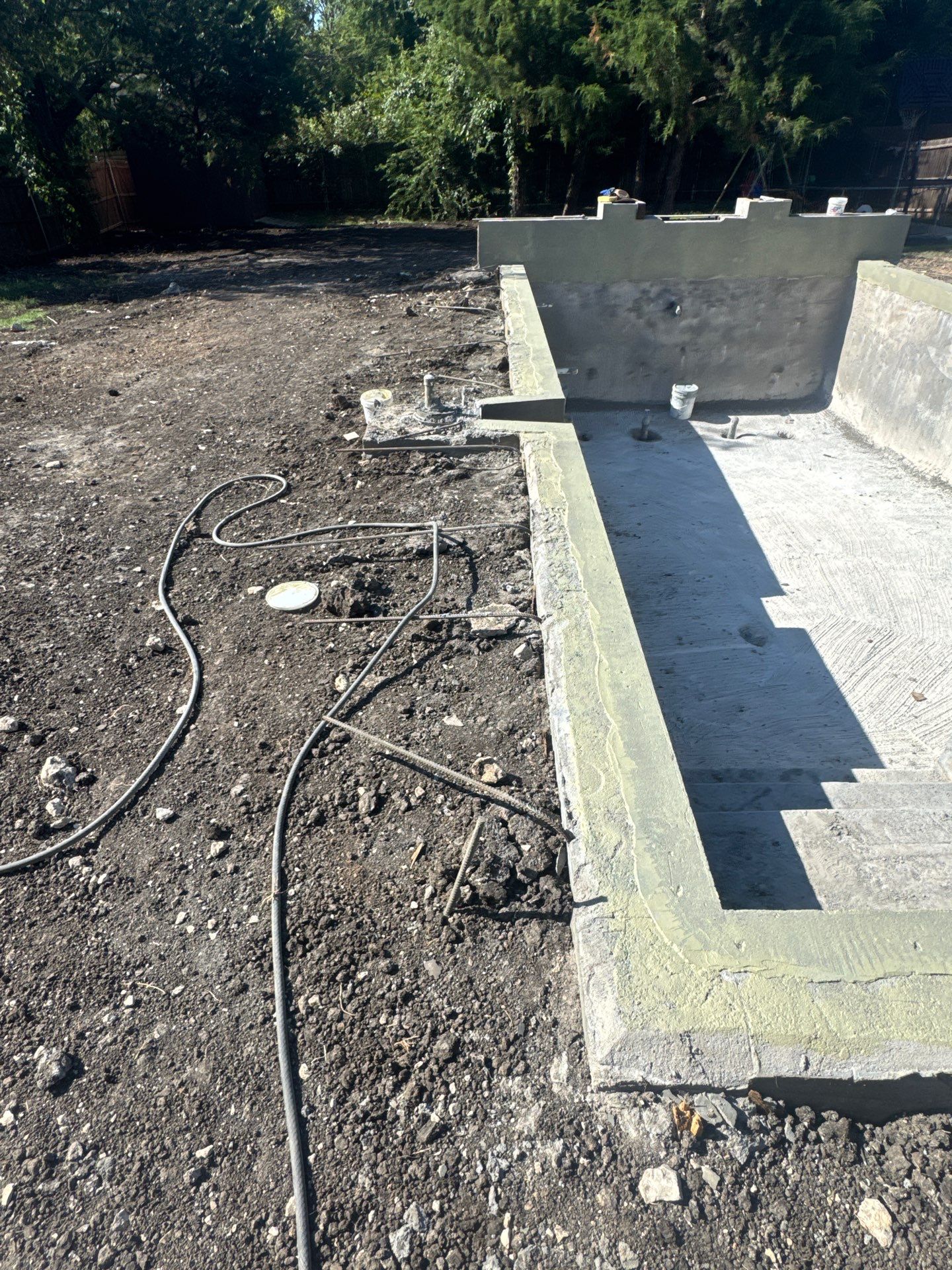 Modern Geometric Pool with Raised Wall and Paver Deck by Pinnacle Pools and Spas - DFW
