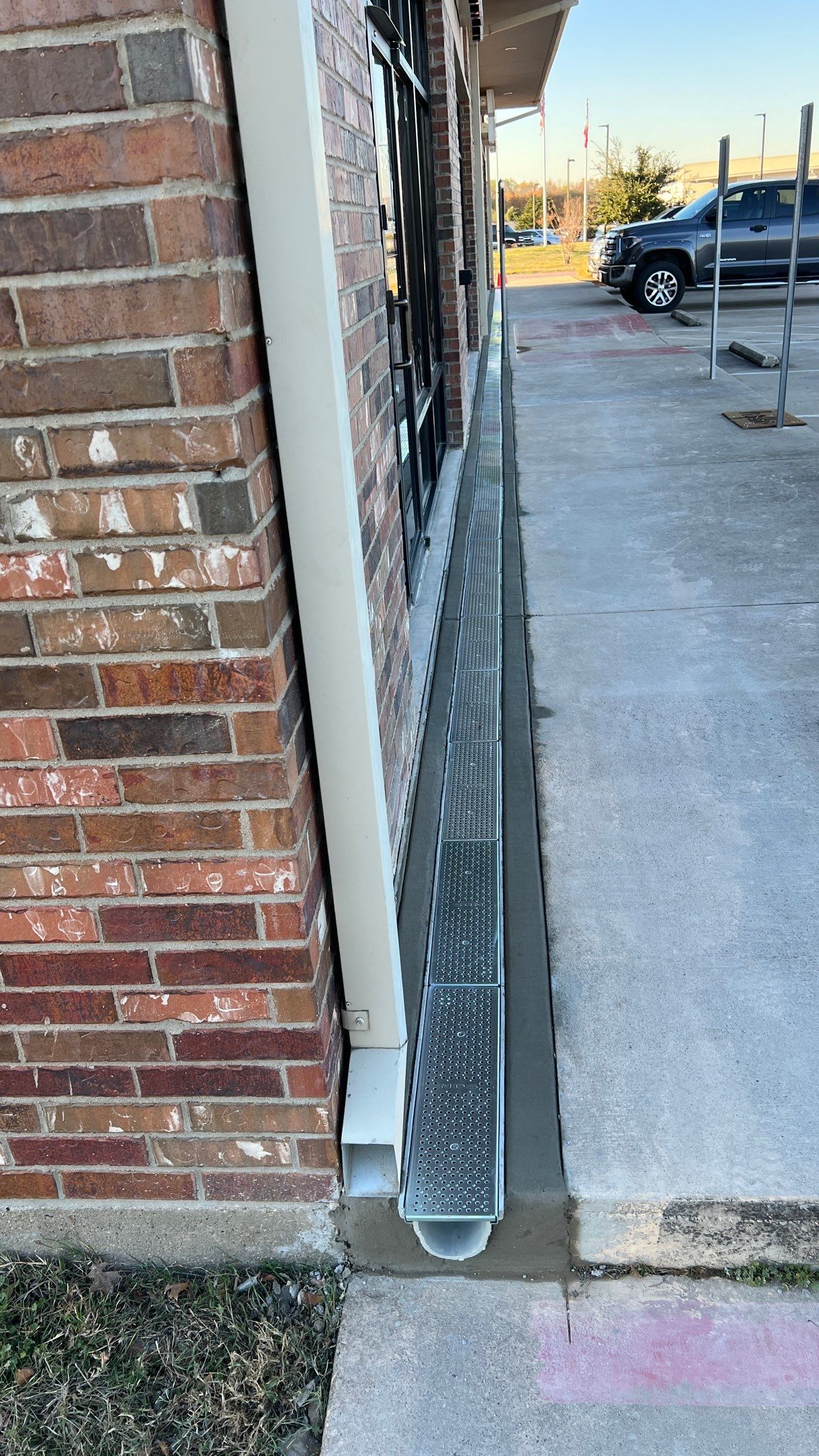 Drainage System Installation and Metal Roof Repairs by Harvey Roofing & Construction