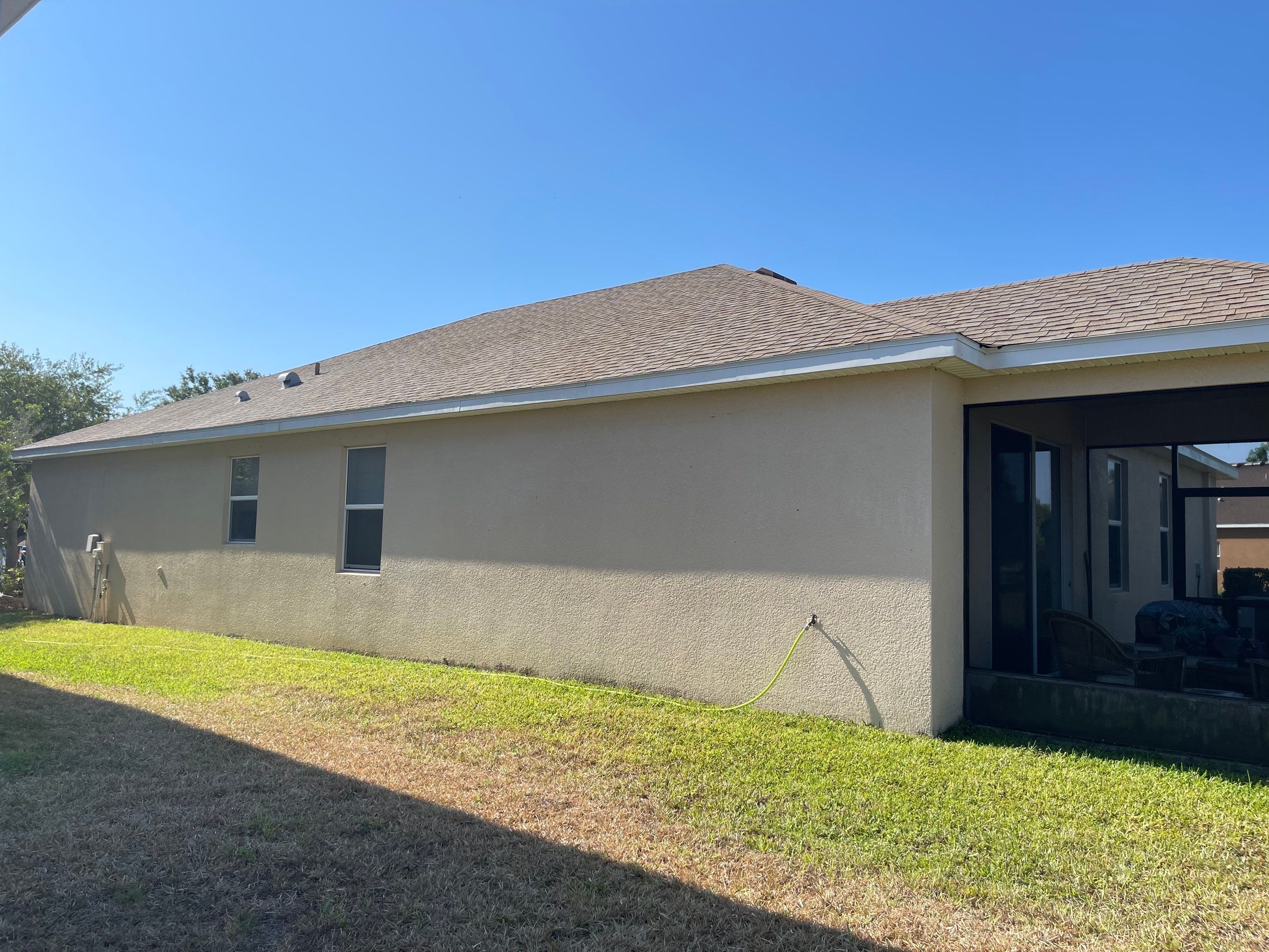 Asphalt Shingle Roof Soft Wash Cleaning & Concrete Pressure Washing in CopperStone Community, Parrish, FL by Sunshine AquaWash