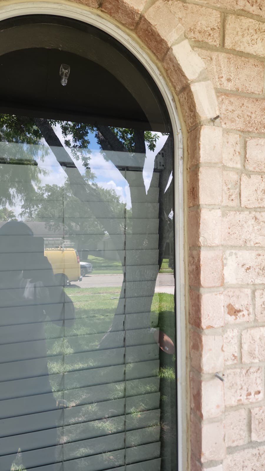 Colored Vinyl Windows to blend into brick by Bayfront Roofing and Construction
