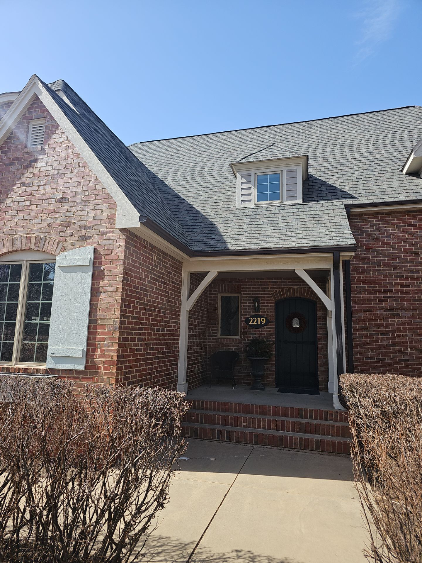 Residential Exterior Brick Painting and Limewash Refresh in Sioux Falls by Select Painting, Coatings & Garage Cabinets