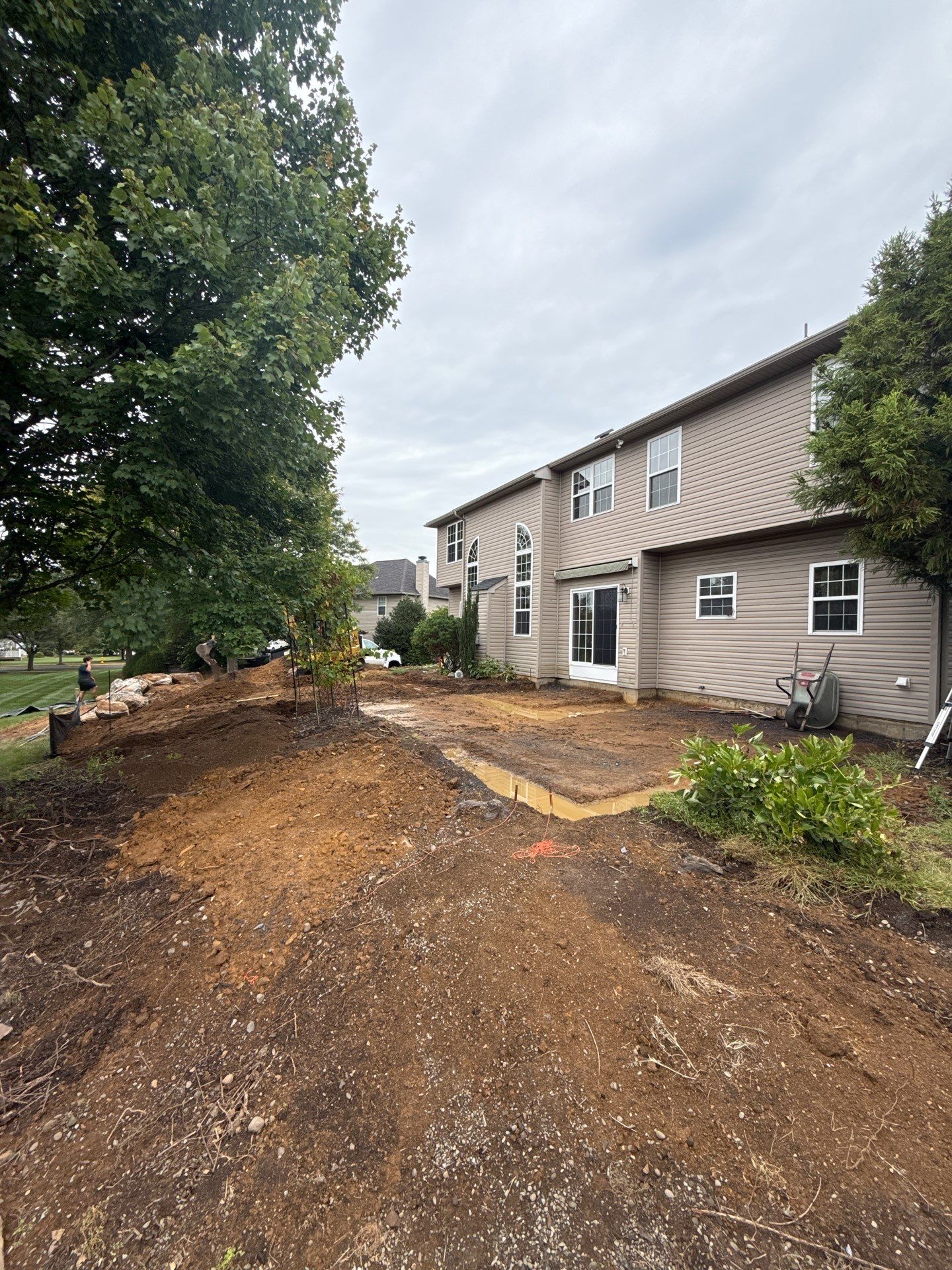 Backyard Retreat: Techo-Bloc Patio + Firepit Lounge by Saylor’s Lawn & Landscape