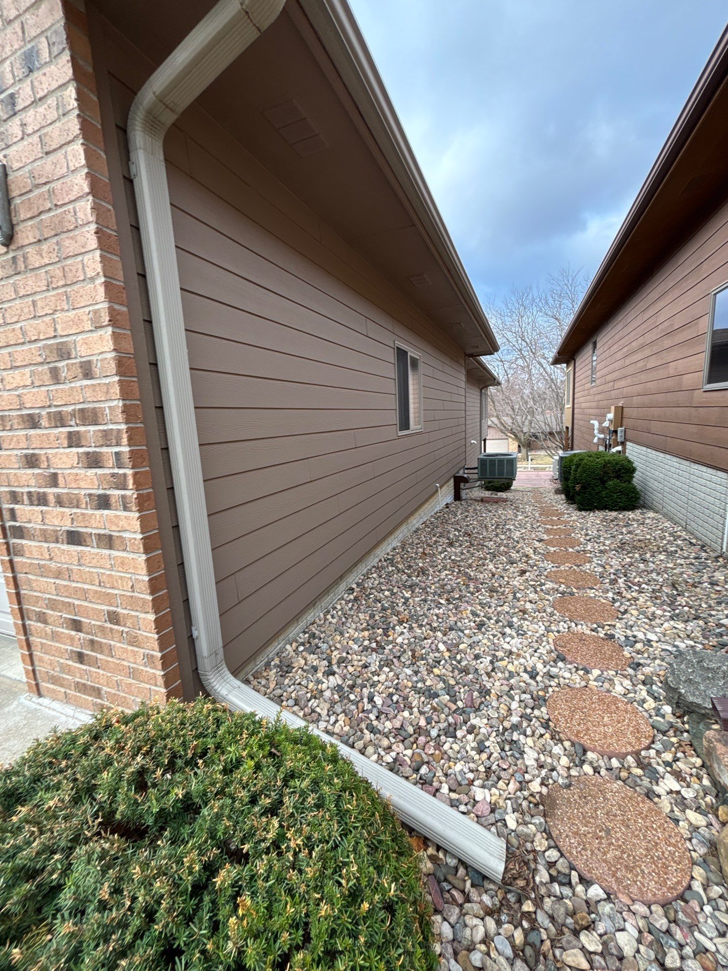 Multi-Story Residential Exterior Painting and Siding Refresh in Sioux Falls by Select Painting, Coatings & Garage Cabinets