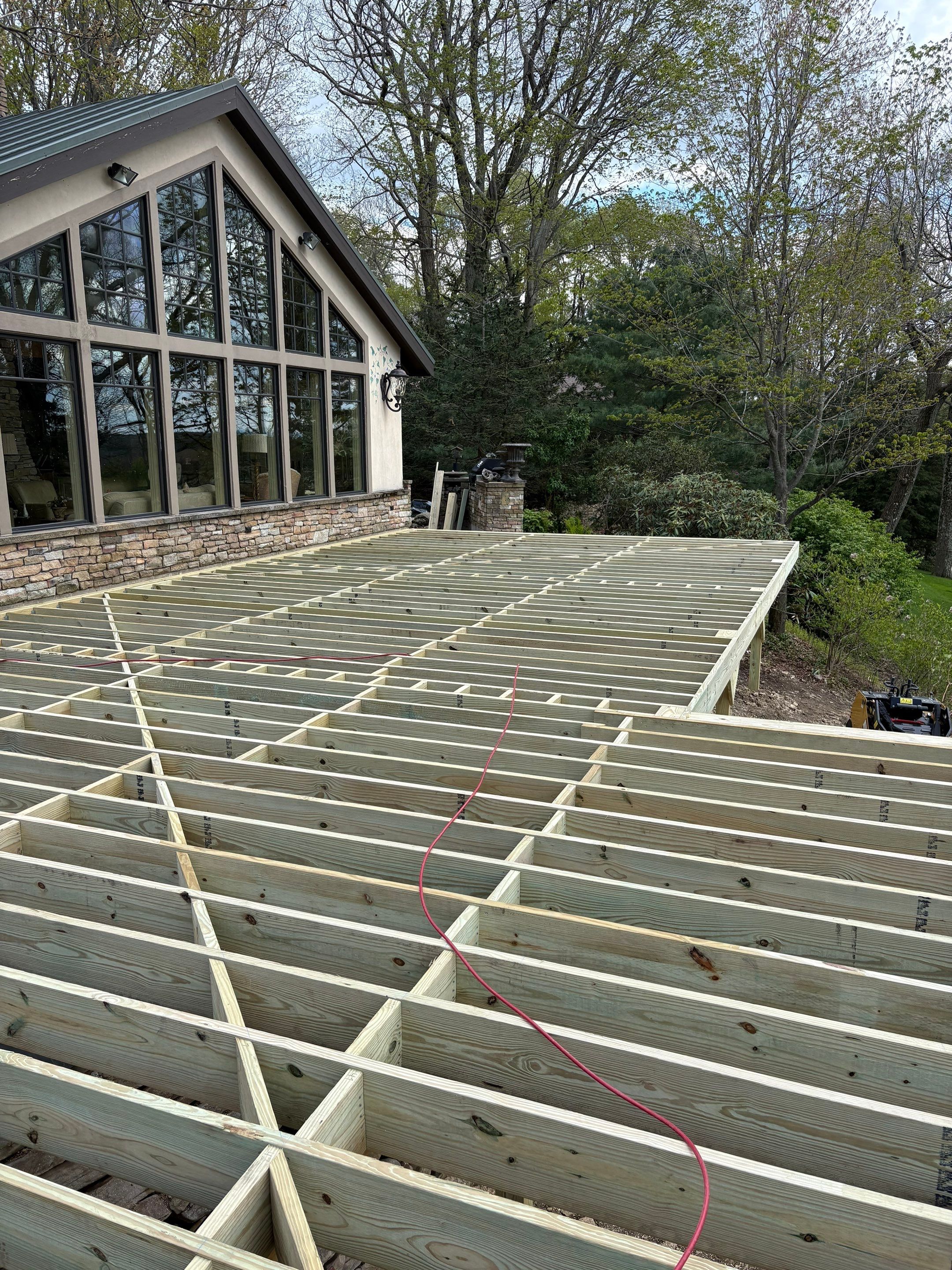 1500 sq/ft Composite Deck Build with Outdoor Kitchen in Champion by Cousins Roofing Siding & Decks