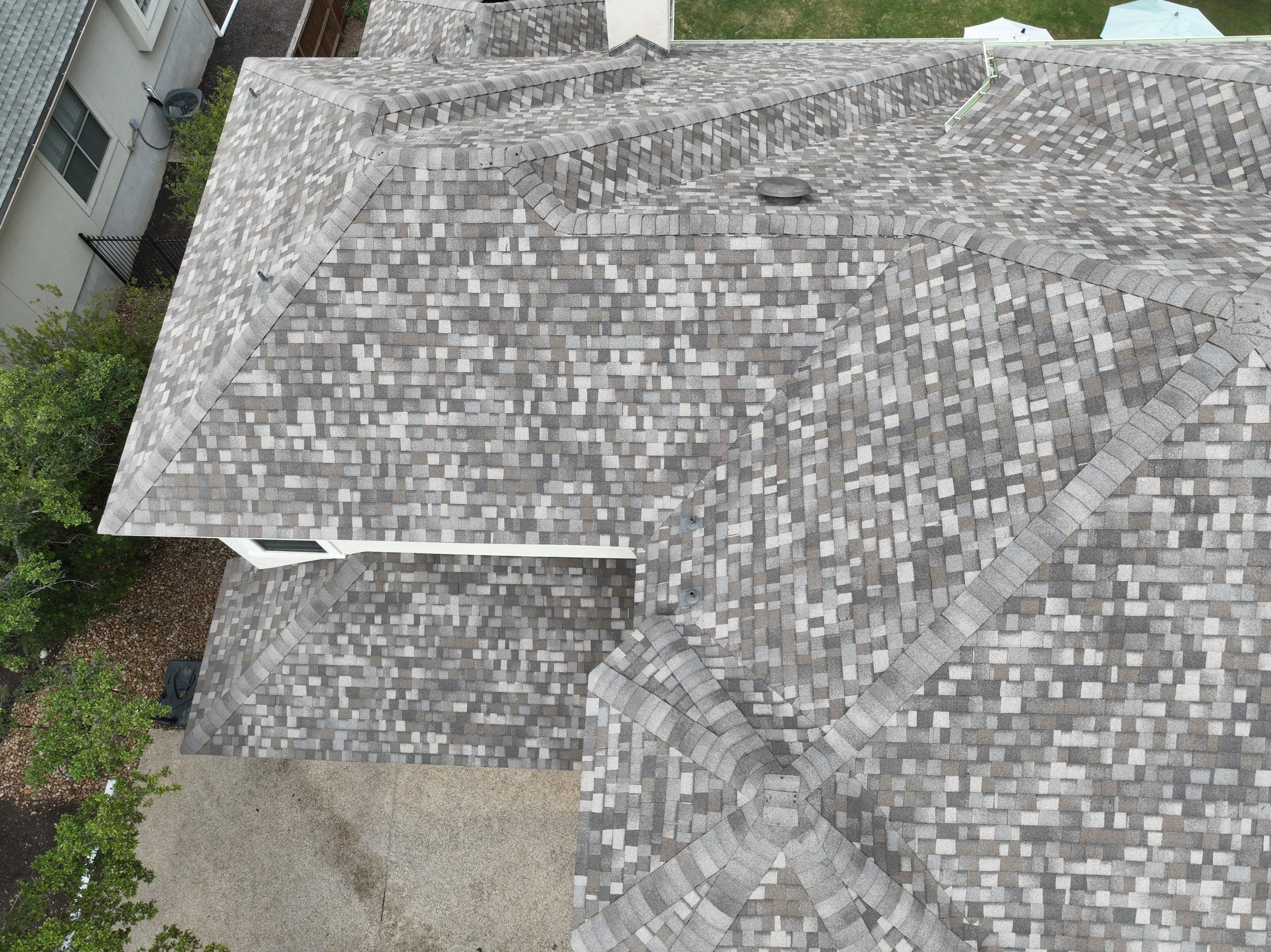 Residential Roof Replacement using 30 Year Laminate Shingles with High Profile Ridge by Premier Roofing and Contracting