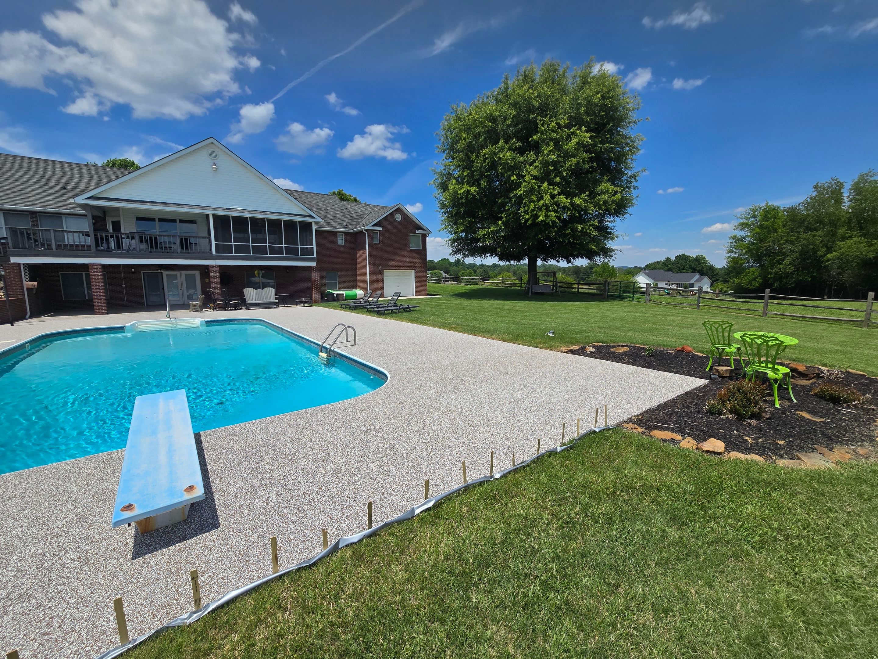 Pool Deck and Porch Using Brownstone and Coldwater Canyon by Elite Floor Solutions