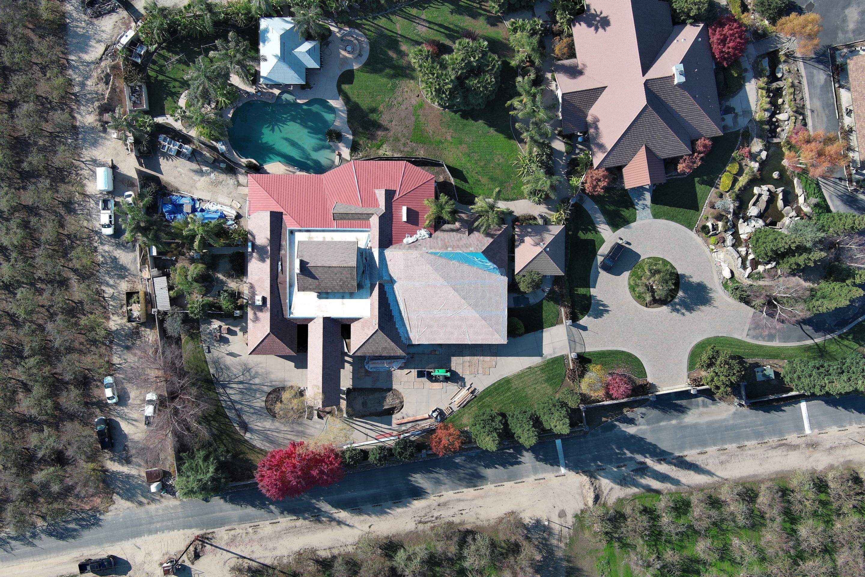 Tile, Metal, and TPO roofing project (new construction) by Straight Edge Roofing Inc