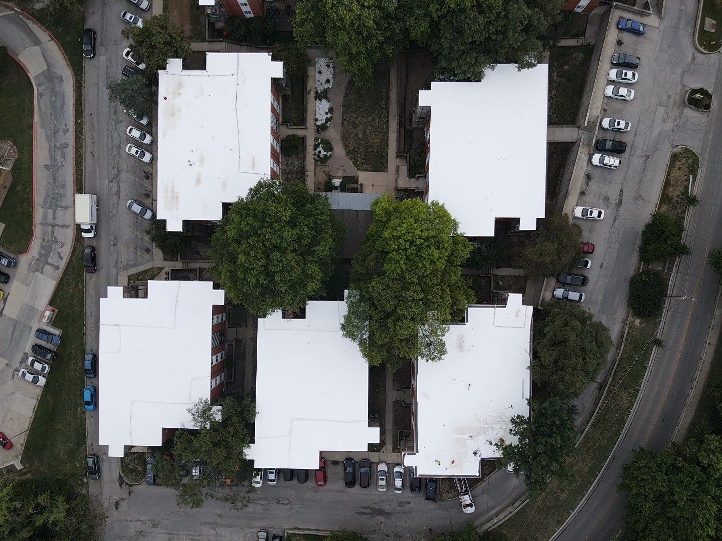 Commercial Flat Roofing System - PVC Membrane & Fluid Applied Coatings  by Titan Commercial & Residential Roofing 