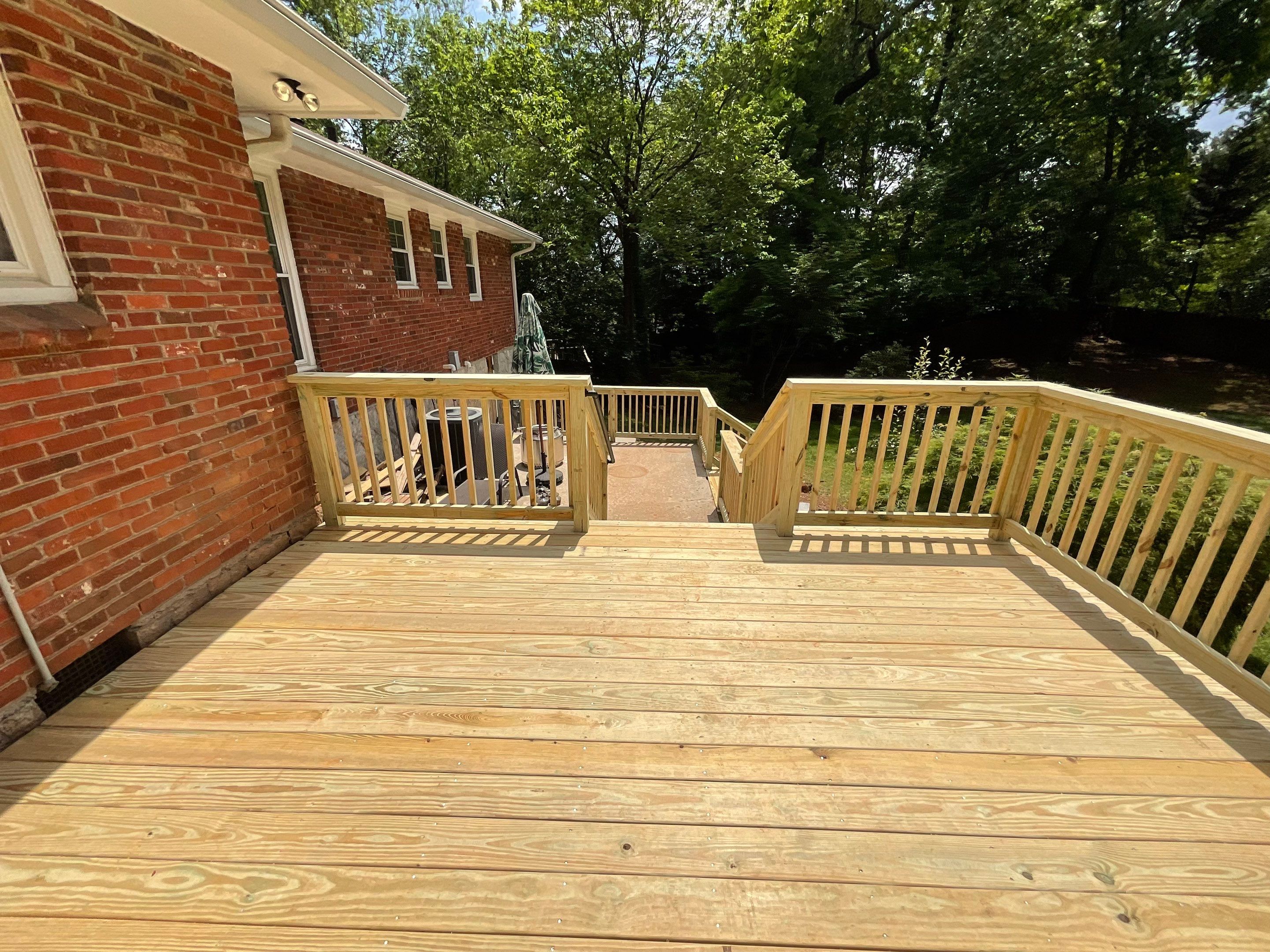 Custom Pressure-Treated Wood Deck and Railing Installation in Decatur by Swift Home Renovations