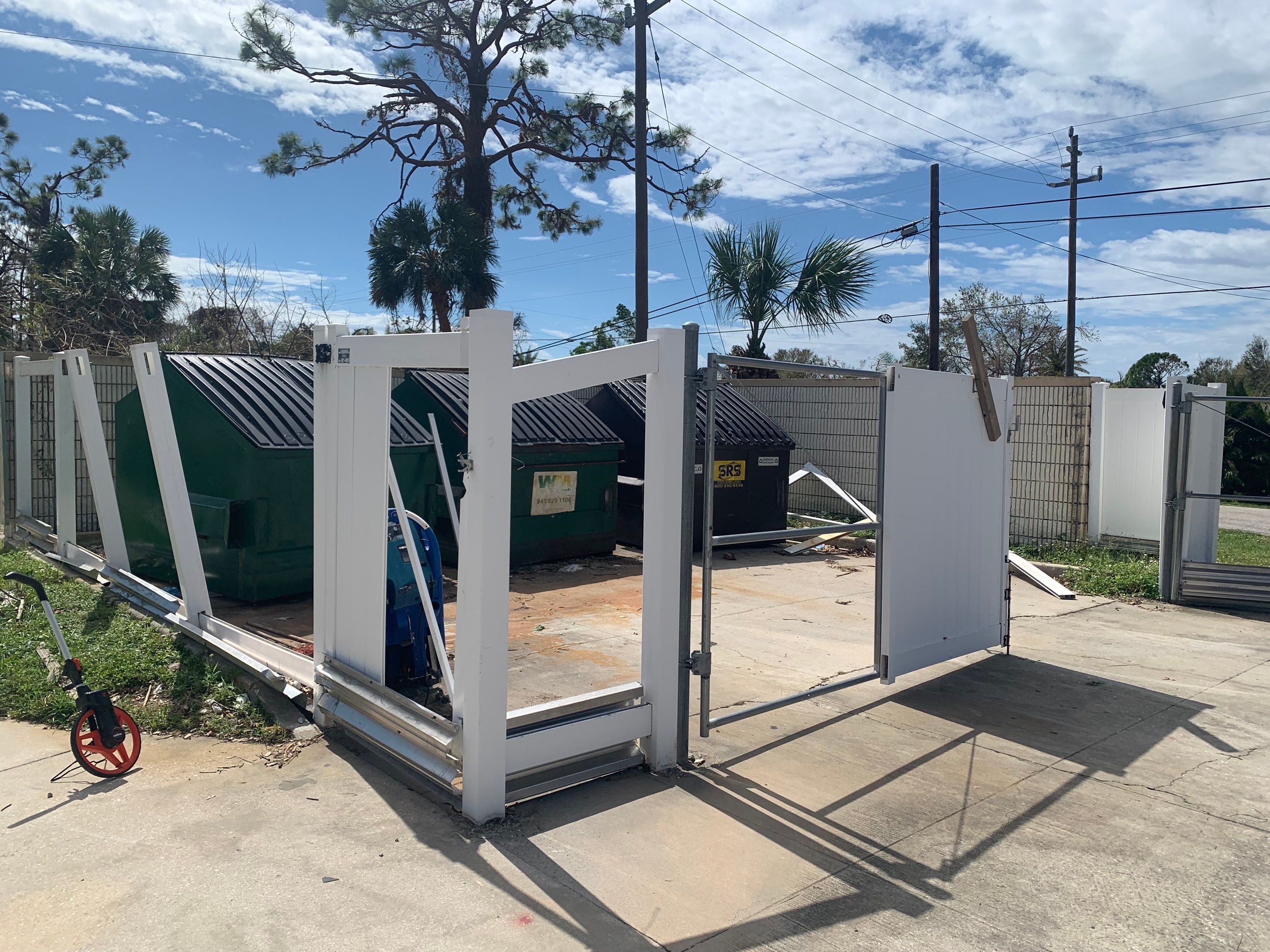 Commercial Chainlink and Vinyl Fence With Aluminum Framed Gates On Dumpster Enclosure by Asap fence and gates, LLC