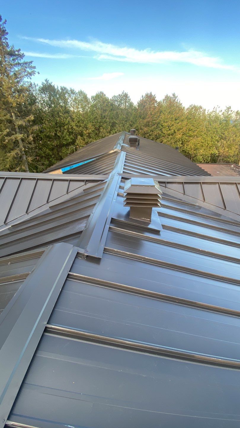 Residential Roofing Installation using 16" Standing Seam Panels by Jay Carter Roofing & Sheet Metal