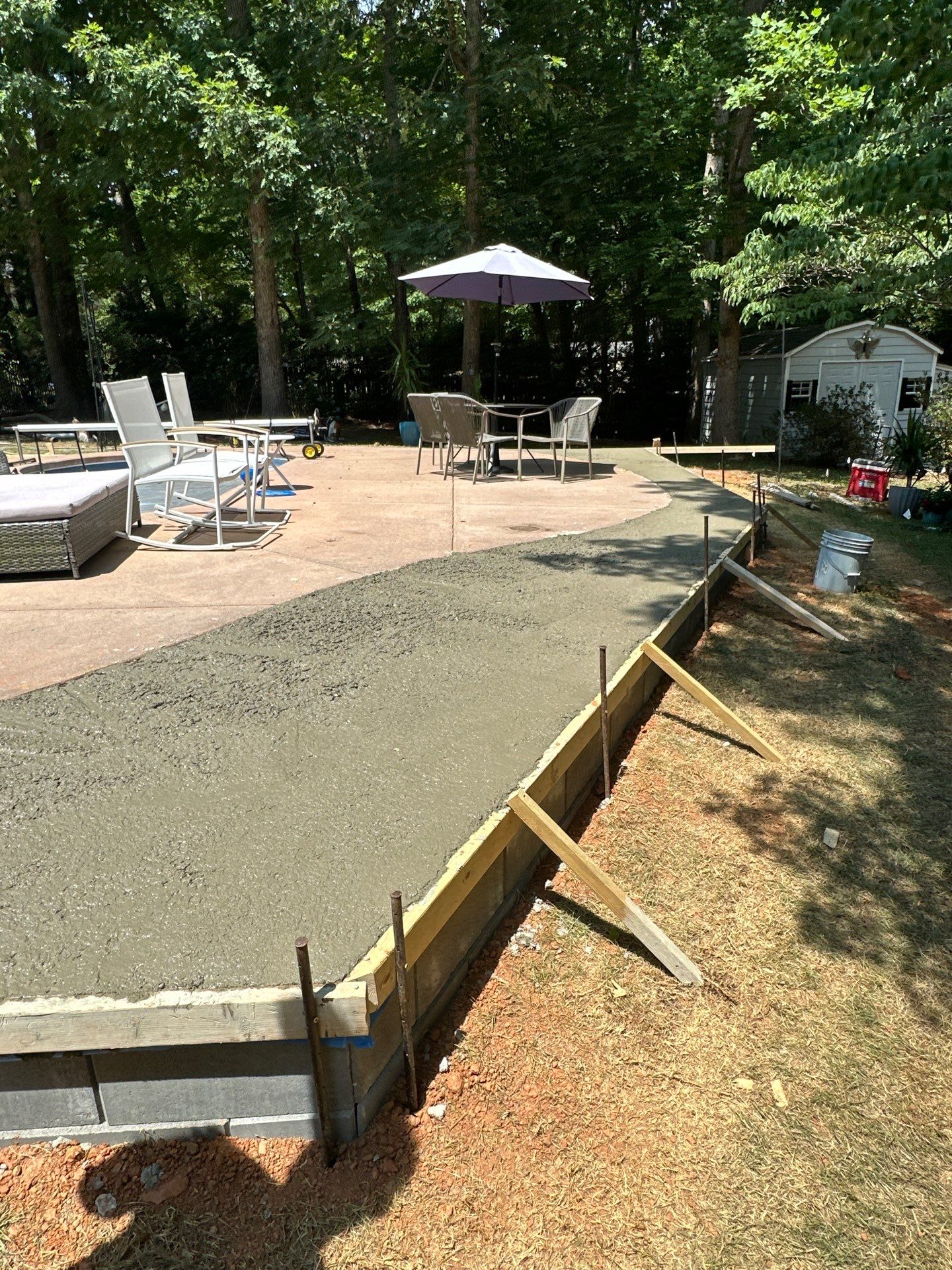Cool decking pool in Youngsville by Martinez Brother’s Nc Landscaping Inc