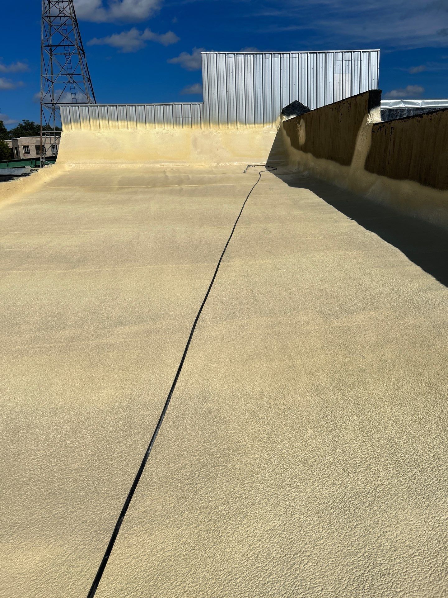 Downtown Gladewater Commercial Foam Roof Restoration – SPF + High-Tensile Acrylic by All Star Roofing LLC