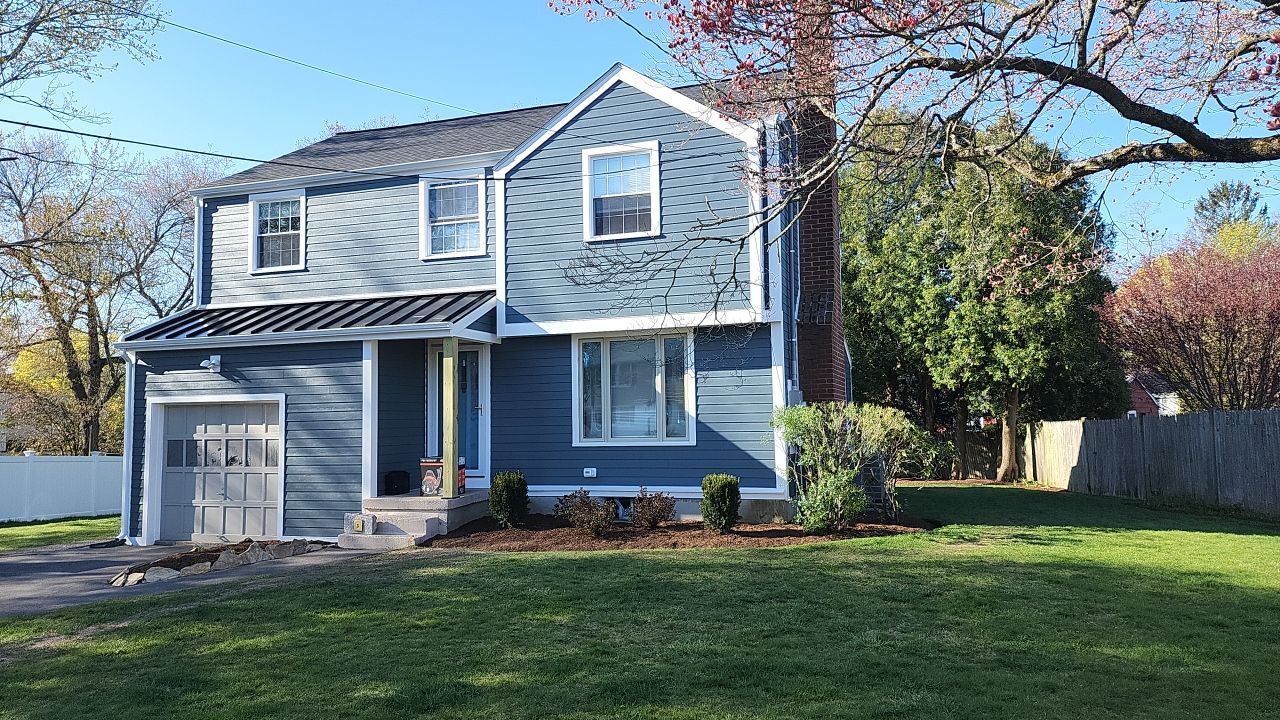James Hardie siding, new metal roof and couple windows being installed. by UBrothers Construction