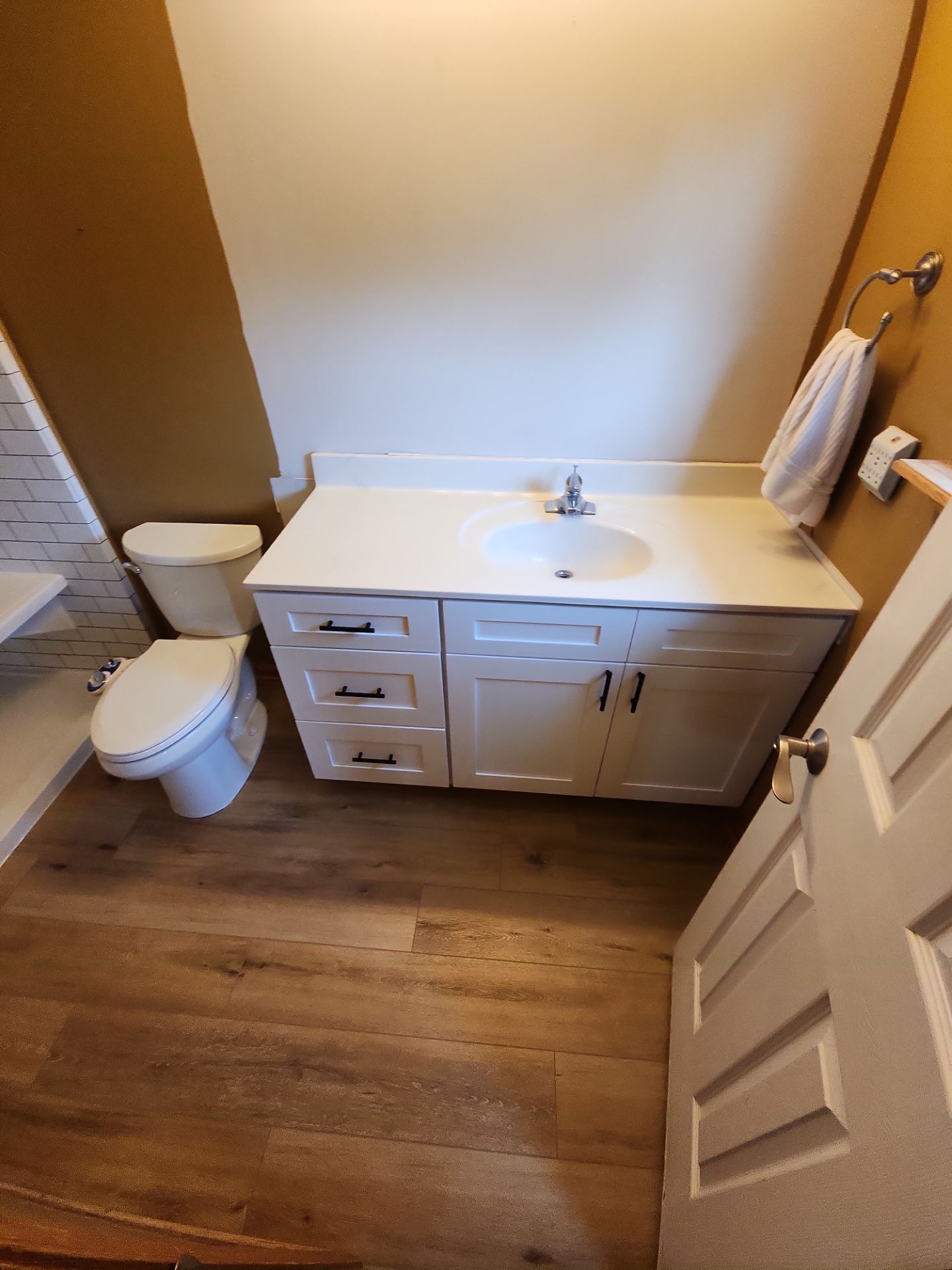 Bathroom Remodel using Luxury Vinyl Plank by The Shower Company
