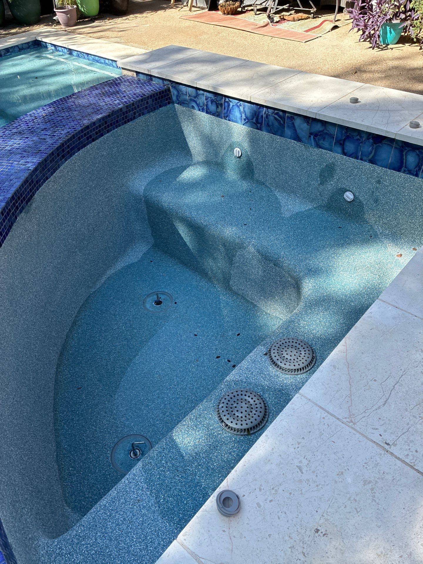 Freeform Pool Remodel with Raised Spa and New Tile by Pinnacle Pools and Spas - DFW