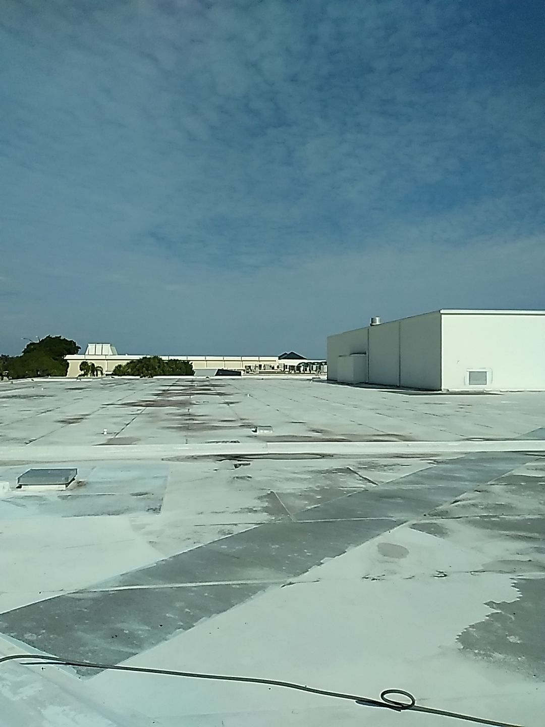 Silicone Roof Coating and Parapet Wall Repairs in South Bradenton by CES Roofing