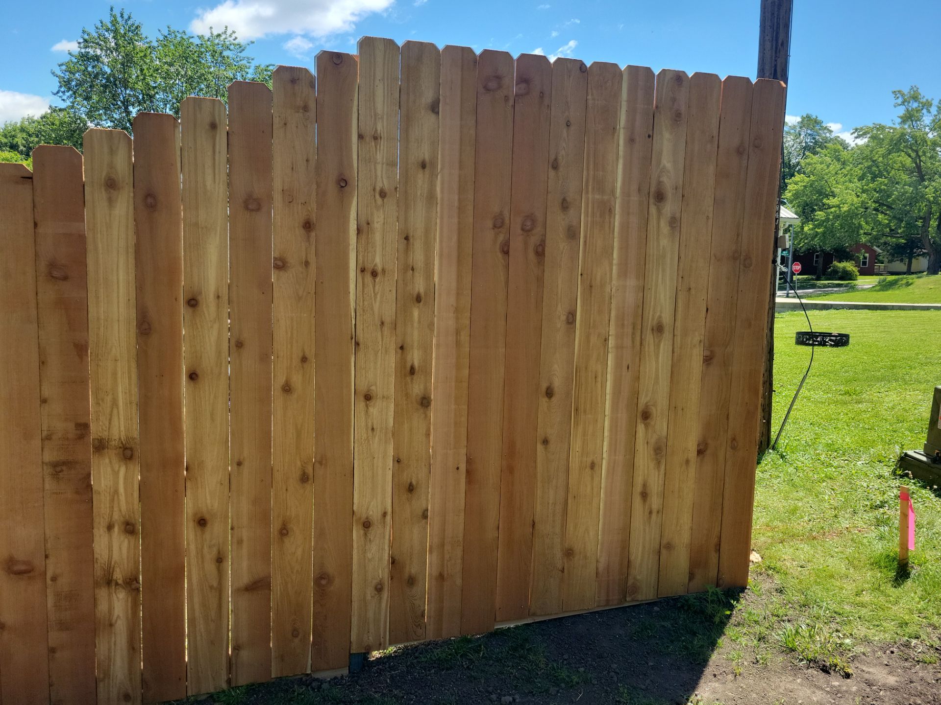 Custom Cedar Unstained Wood Privacy Fence Installation in Cedar Falls by Perfect Picket Fence and Stain