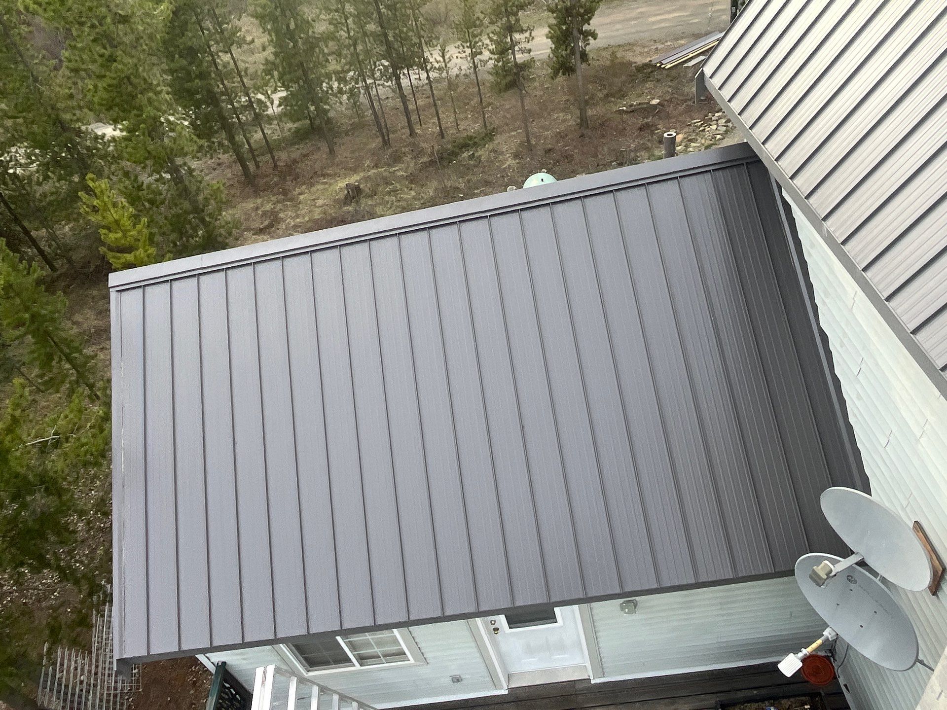 Shingle to Metal Roof Conversion by Top Notch Roofing Inc