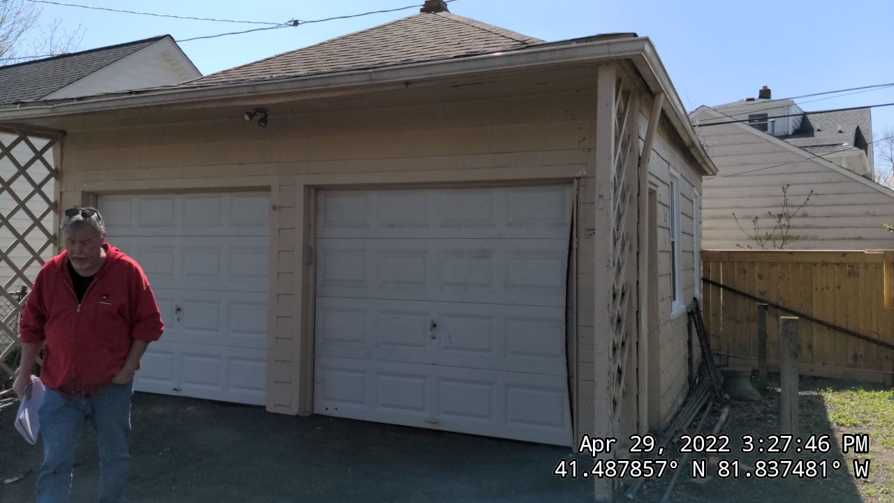 Residential Roofing Installation, Dec-tek walk-out porch roof, siding on garage by Absolute Roofing and Construction
