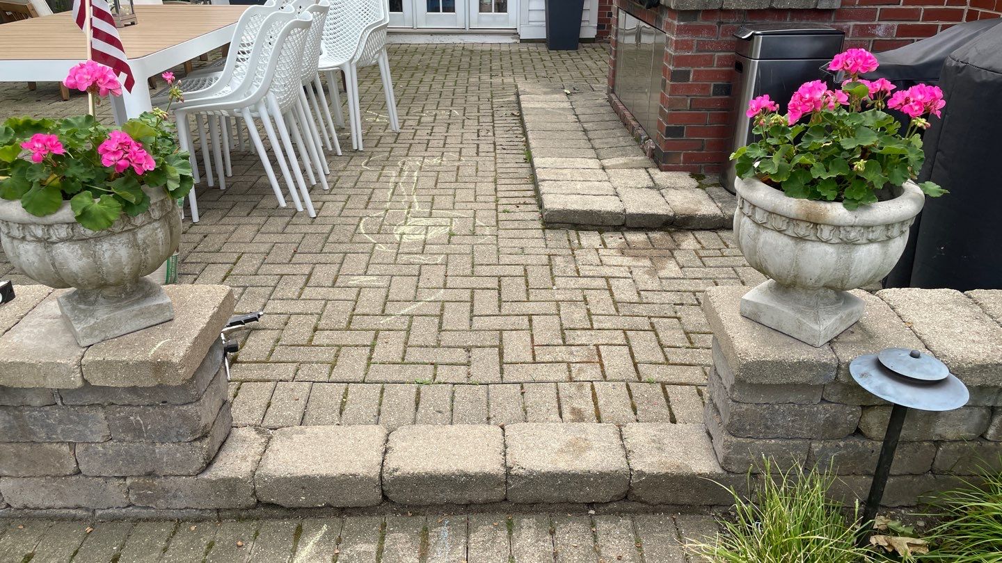 Brick patio repair, clean sand and seal by Northern Power Washing LLC.