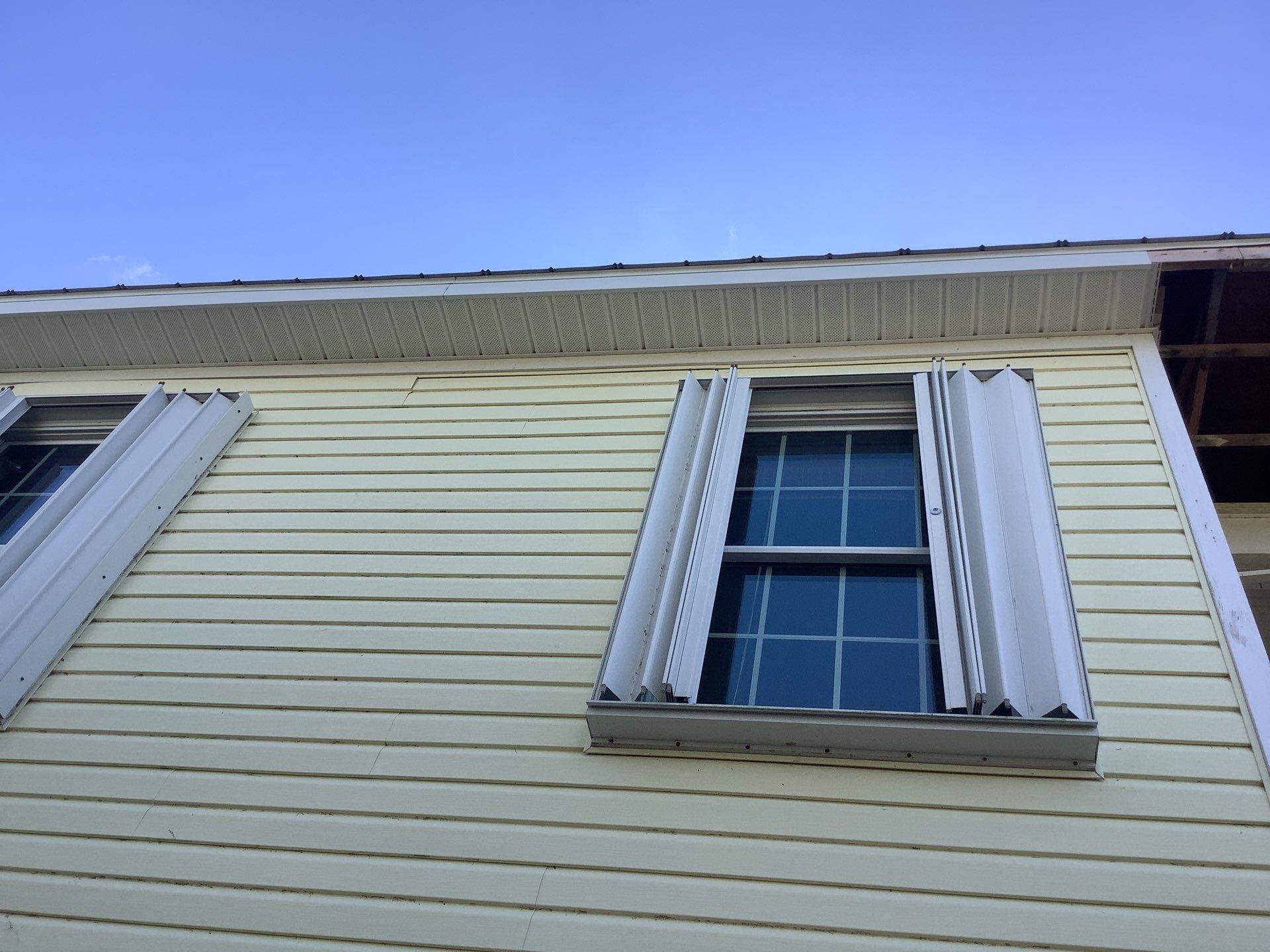 White Gutters with Matching Downspouts in Sarasota FL by Gutter Professors