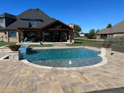 Freeform Pool and Spa with Travertine Decking and Bubblers