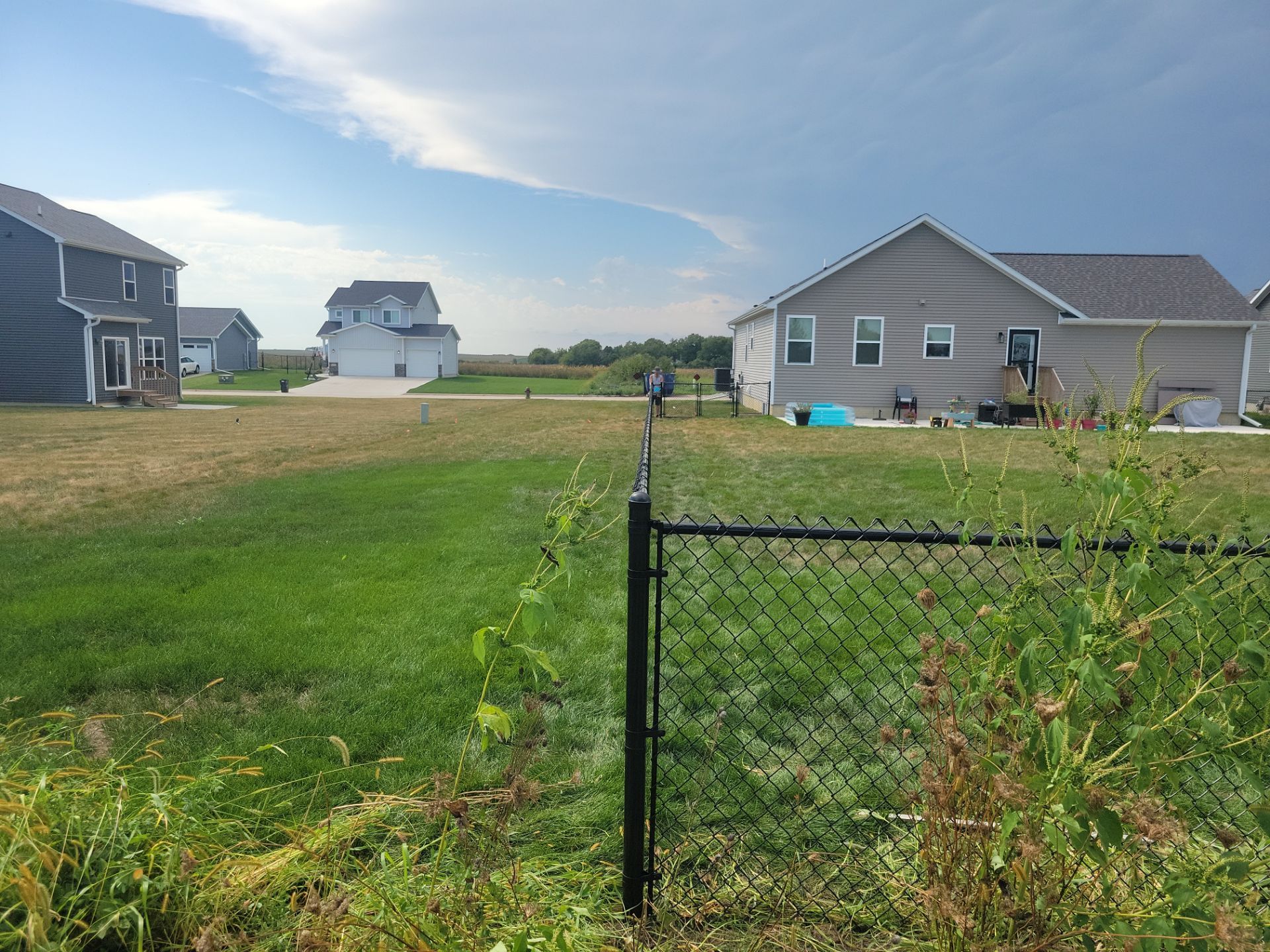 Residential Black Chain Link Fence Installation in Jesup by Perfect Picket Fence and Stain