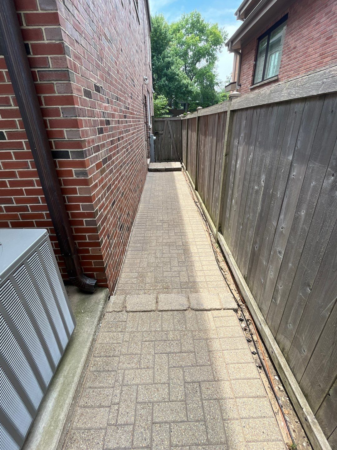 Brick patio repair, clean sand and seal by Northern Power Washing LLC.