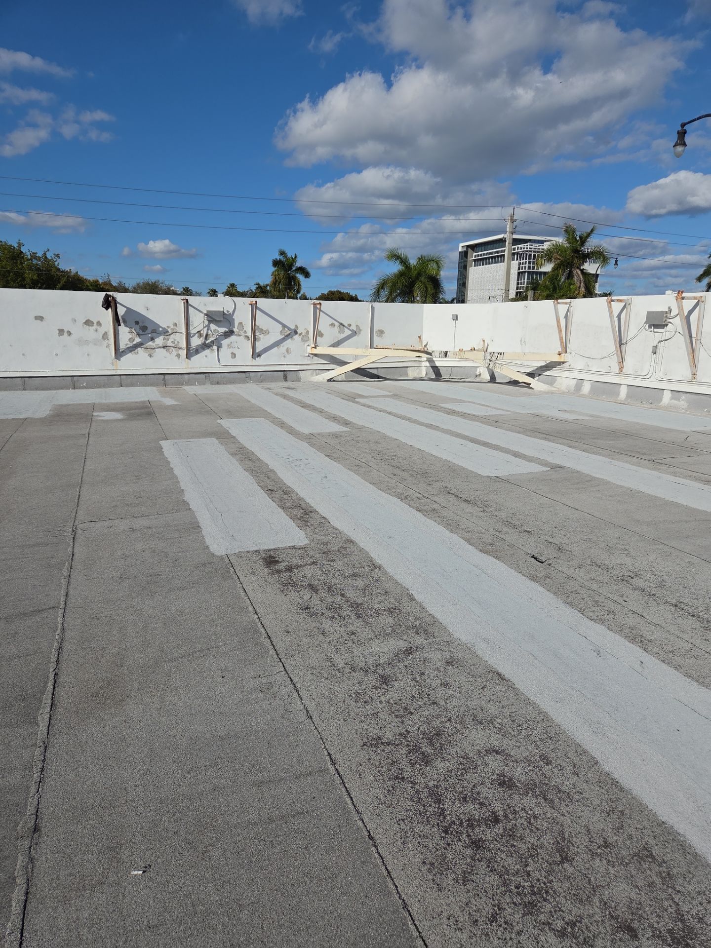Commercial Flat Roof Restoration Using Silicone Coating in Hallandale Beach by Aastro Roofing