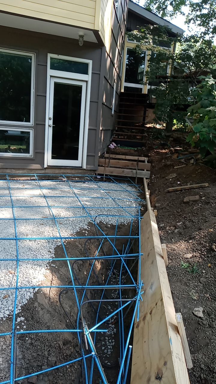 Back Yard Cantilivered Patio by LAND ESCAPES LLC