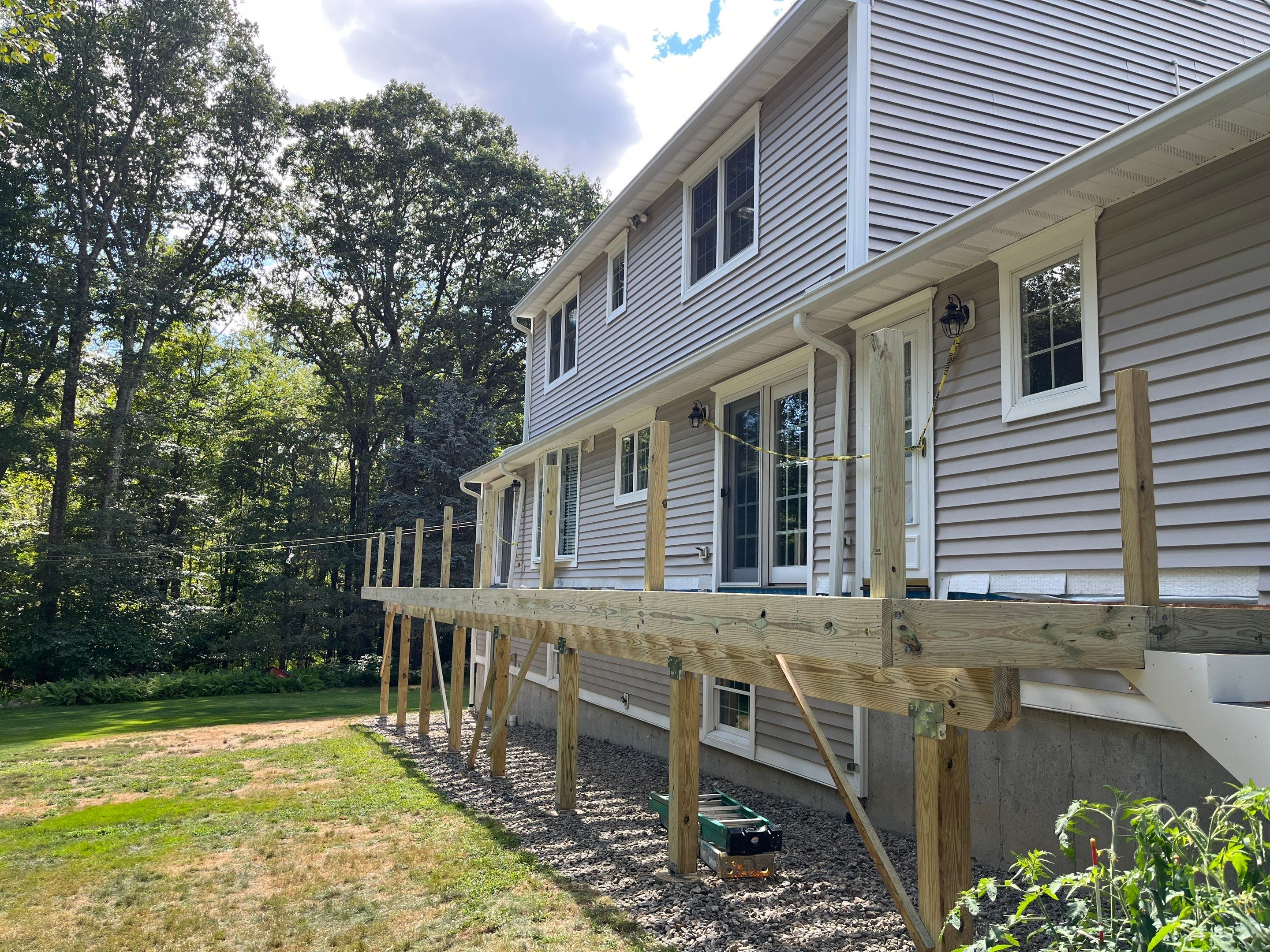 Replacement of front and back decks using Trex Lineage Island mist and Trex Lineage Rainier by DiGiorgi Roofing and Siding Inc