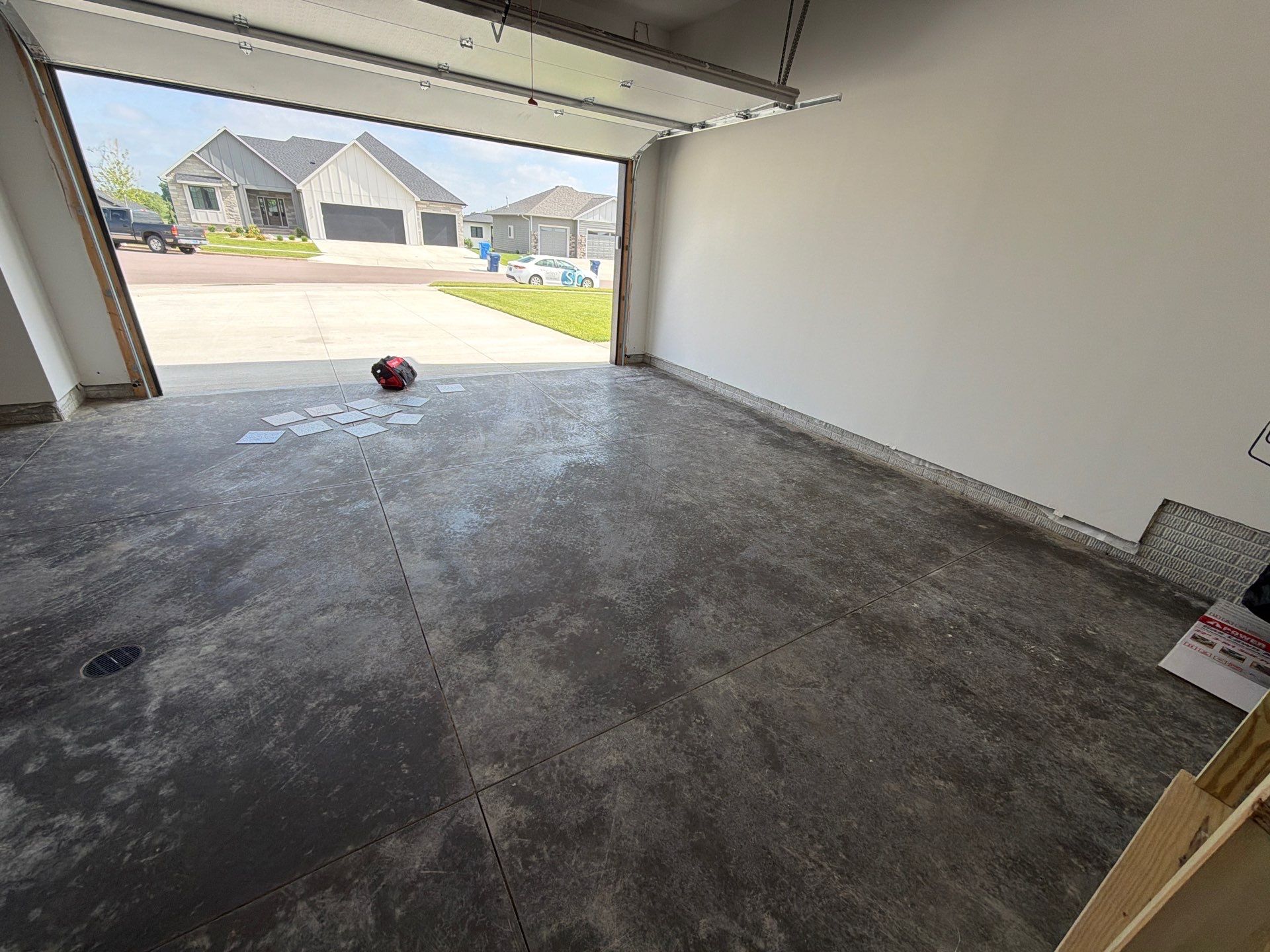 Cabin Fever Decorative Flake Garage Floor Coating in Sioux Falls by Select Painting, Coatings & Garage Cabinets