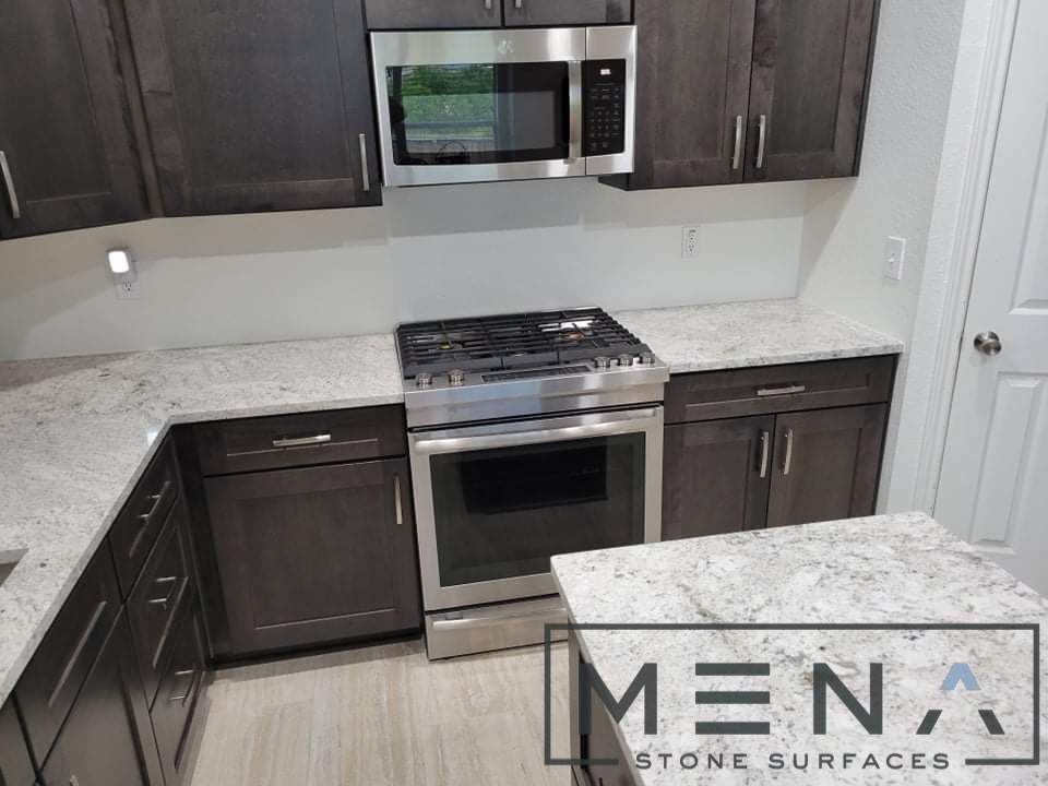 Kitchen countertops using Salinas White Granite  by Mena stone surfaces