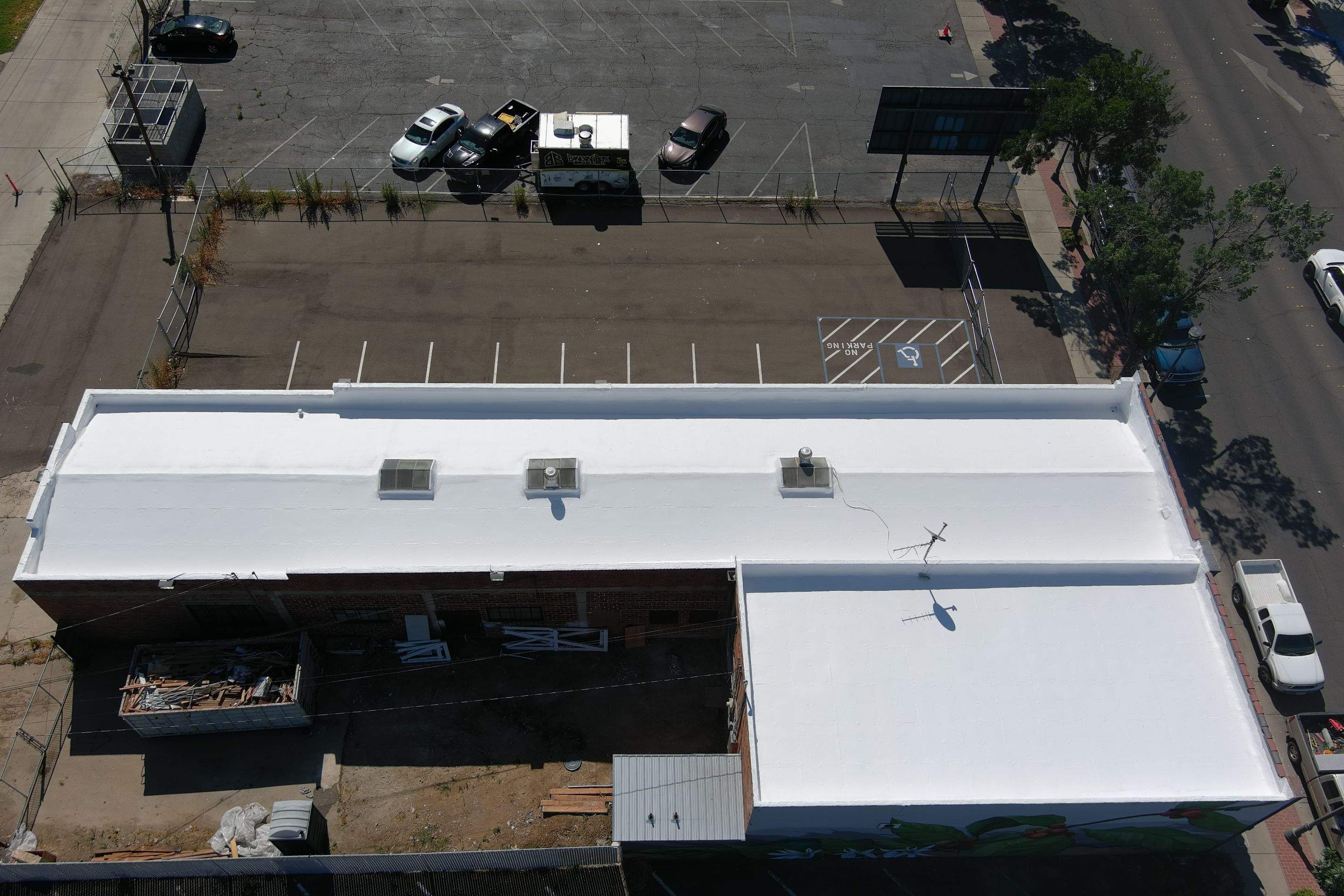 Commercial Roofing Installation using Conklin BenchPly system with PUMA top coat (imbedded fabric system) by Straight Edge Roofing Inc