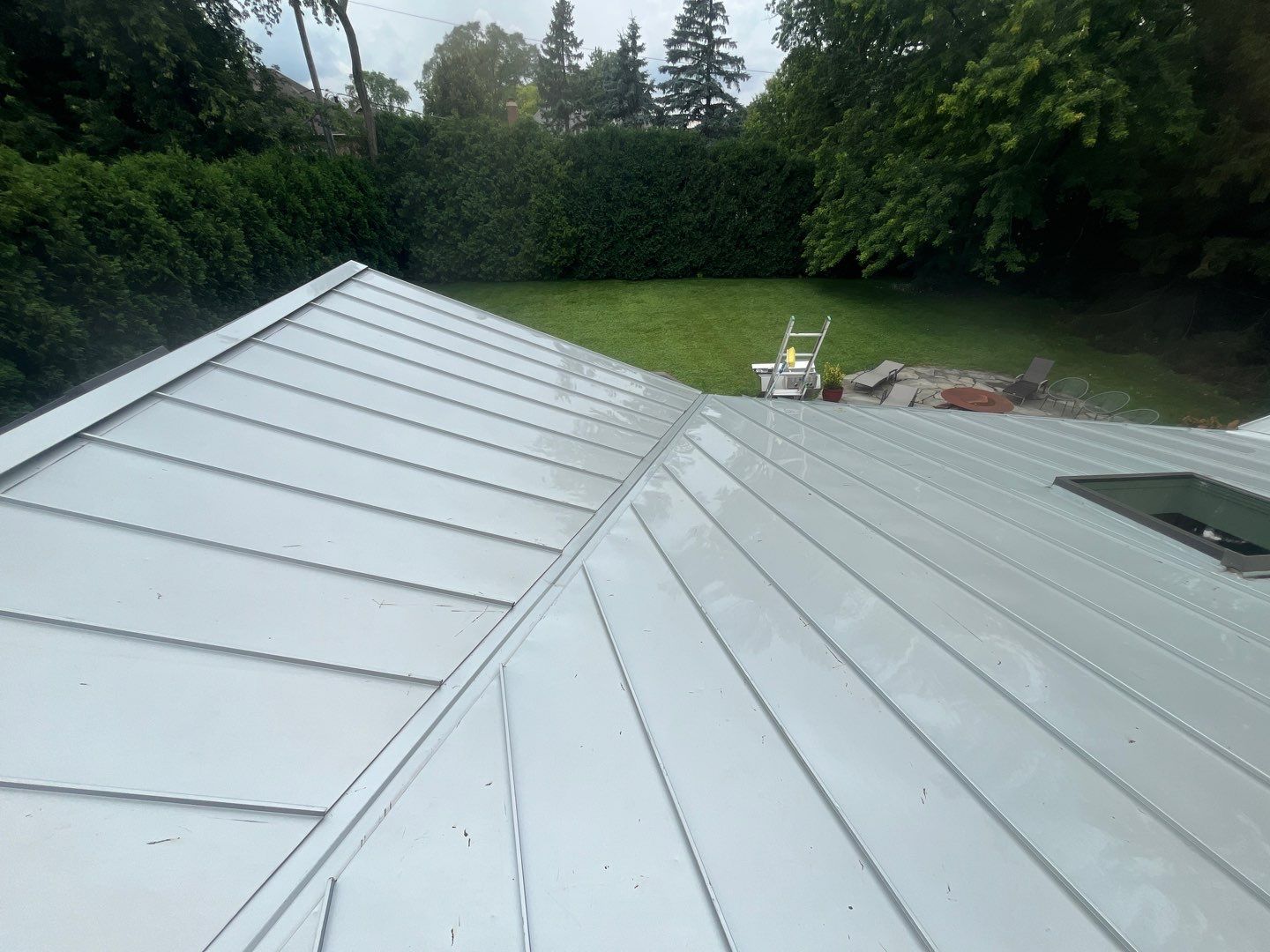 roof washing using Algaecide, soft wash soap by Northern Power Washing LLC.
