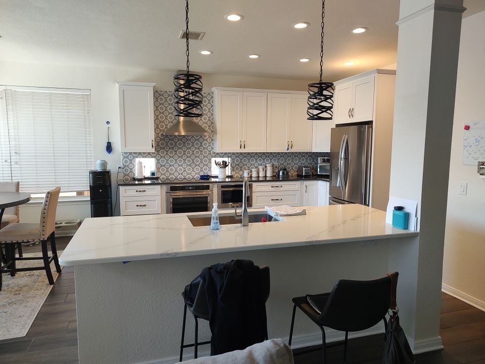 Stone Oak San Antonio Kitchen Remodel Featuring Custom White Cabinetry & Expanded Island by Legacy Bath and Kitchen 