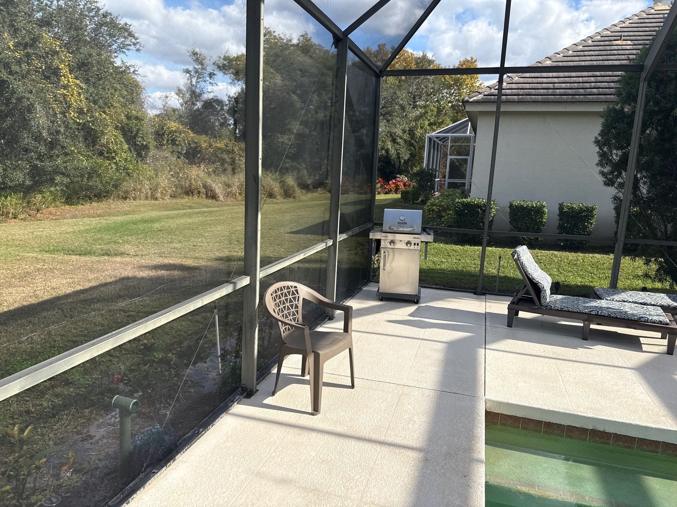 Painted Pool Deck, Lanai & Pool Cage Cleaning in River Club South – Bradenton, FL by Sunshine AquaWash