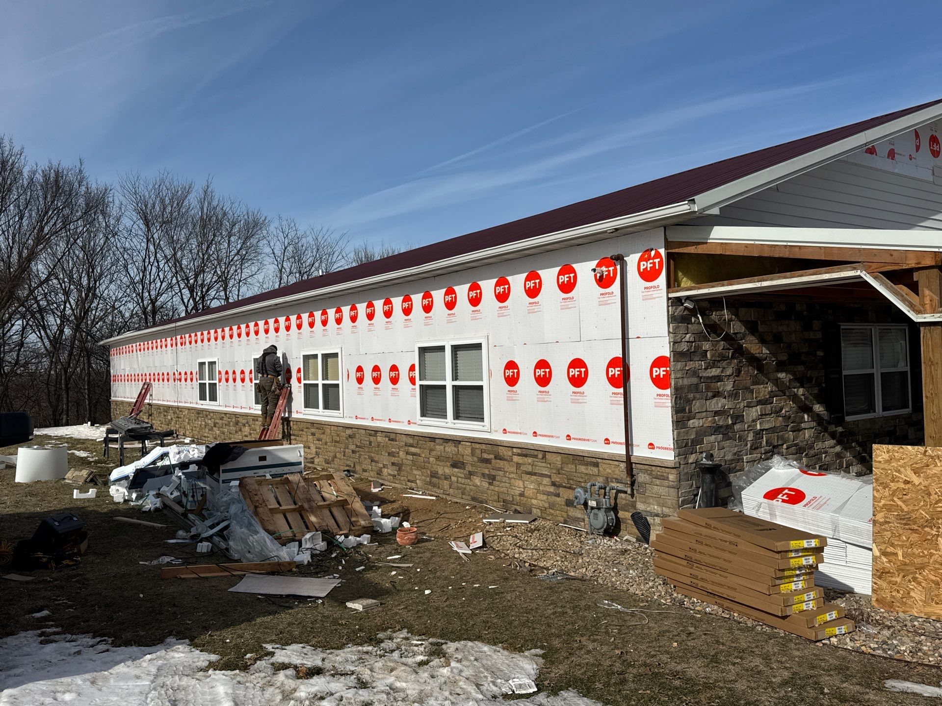 Siding and Stone Installation using Extrerior Porfolio Vinyl Siding and Versetta Stone by EEC  Windows, Siding & Roofing 