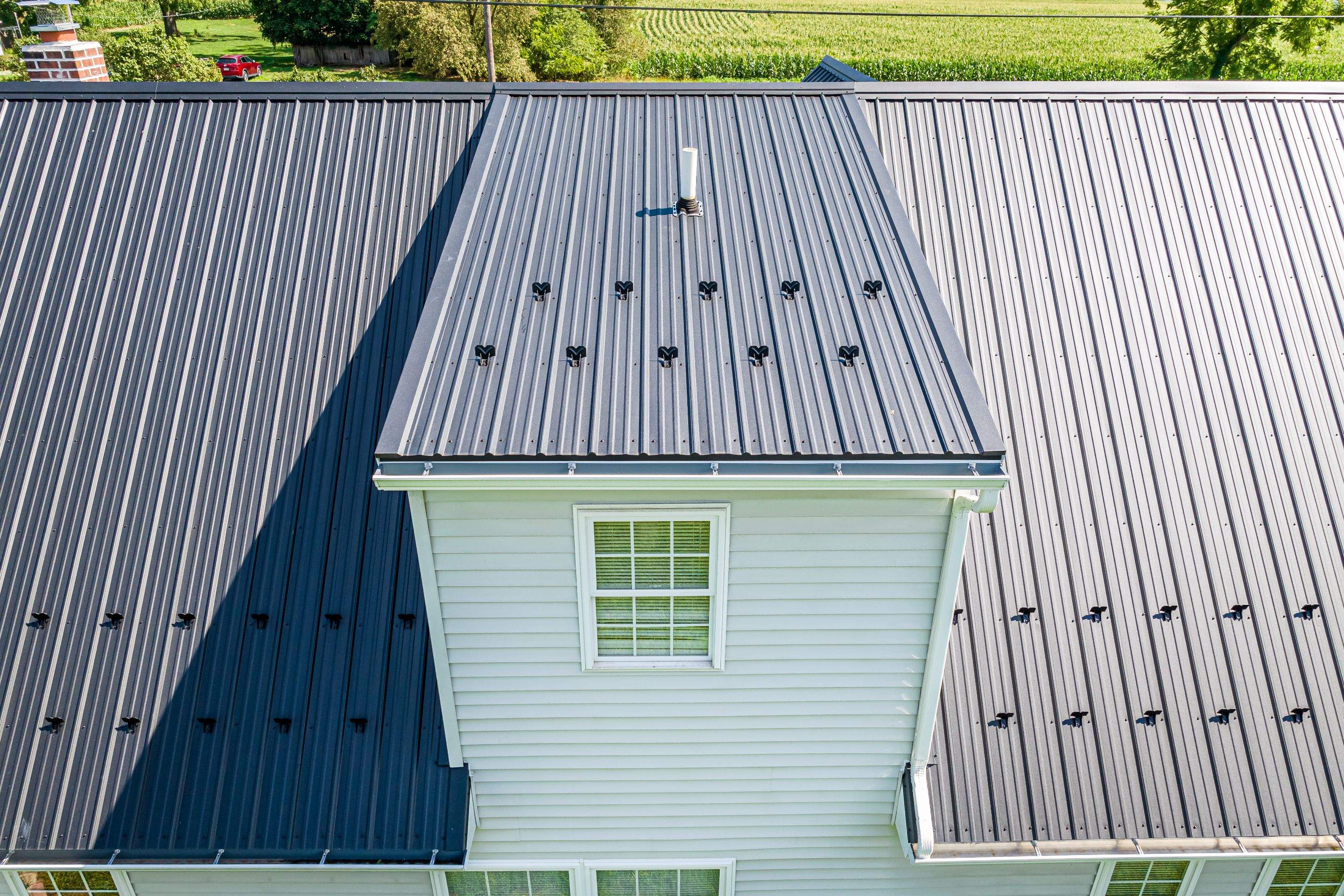 Metal roof install - black by Esh Builders